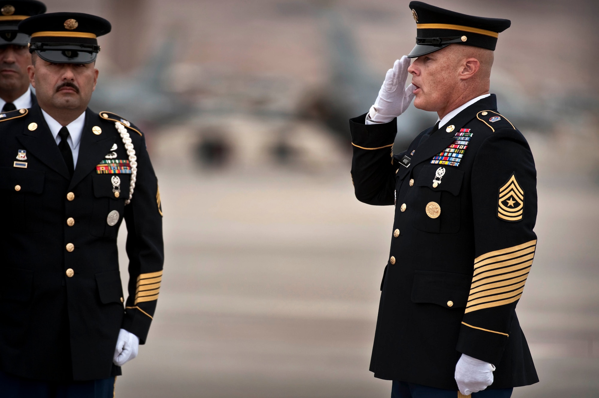 Nevada Army National Guard Sgt. Maj. Ronald Mose, salutes U.S. Army Spc. Dennis James Jr., as he arrives at Nellis Air Force Base Nev., Sept. 13, 2011. James was deployed to Afghanistan from the 10th Mountain Division at Fort Polk, La. when he was killed by an improvised explosive device, Aug. 31, 2011. James will be entered into the Southern Nevada Veteran Memorial Cemetery Sept. 26, 2011 at Boulder City, Nev.(U.S. Air Force photo by Tech. Sgt. Michael R. Holzworth/Released)