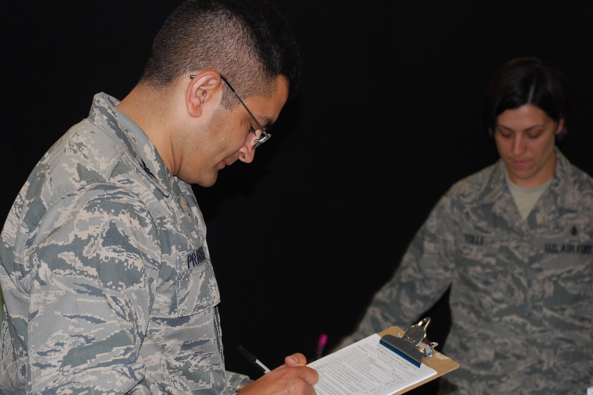 Col. Om Prakash fills out paperwork to receive his annual flu mist vaccination Sept. 14, Sheppard Air Force Base, Texas. Flu vaccinations will be available for all active duty, dependents and retirees at the Sheppard Immunization Clinic beginning Sept. 19. 