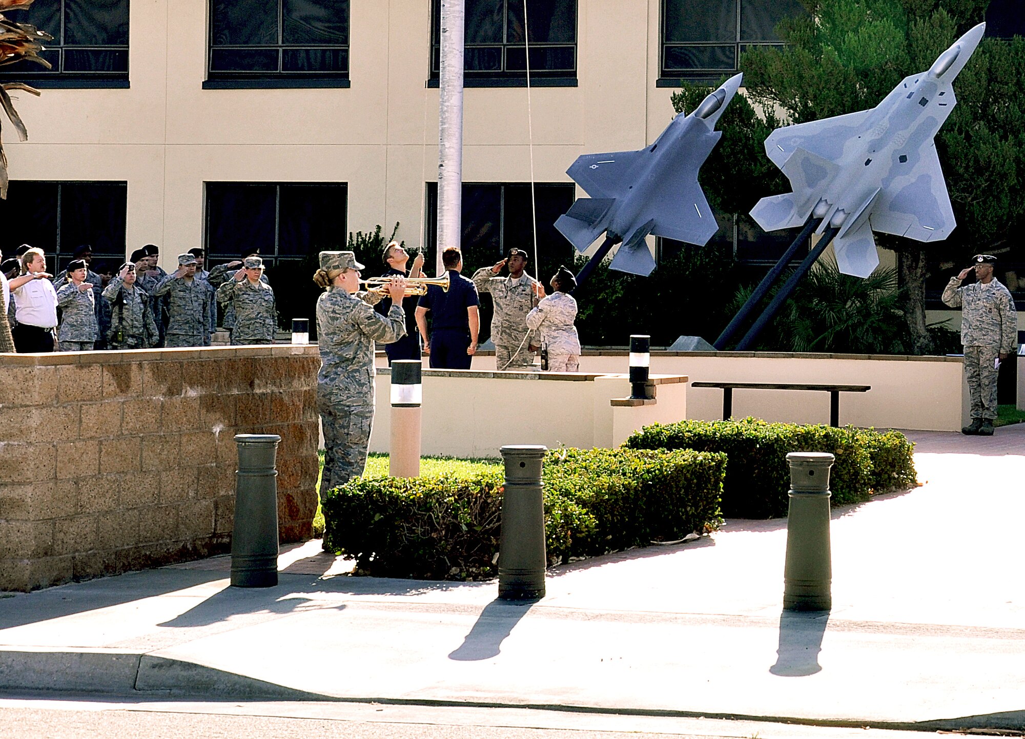 Airman First Class Jennifer Andrade, Edwards Honor Guard, plays “Taps” during Edwards’ 10th anniversary remembrance of 9/11. Team Edwards paid tribute to the victims of the terrorist attacks and those who lost their lives in service during the War on Terror.  (Air Force photo by Staff Sgt. Angelique Smythe)