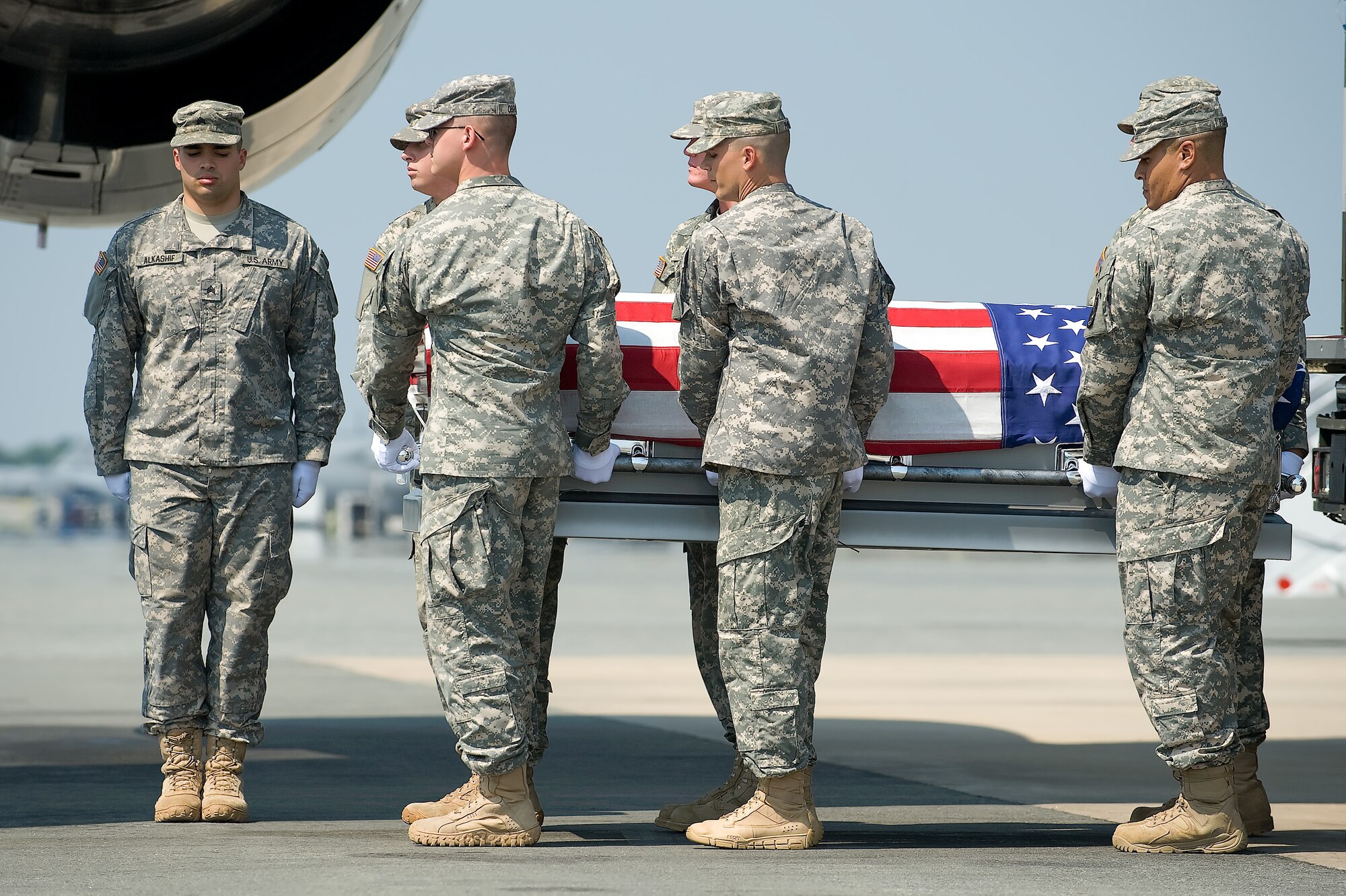 A U.S. Army carry team transfers the remains of Army Spc. Christophe J. Marquis, of Tampa, Fla., at Dover Air Force Base, Del., Sept. 14, 2011. Marquis was assigned to the 1st Battalion, 5th Infantry Regiment, 1st Stryker Brigade Combat Team, 25th Infantry Division, Fort Wainwright, Alaska. (U.S. Air Force photo/Steve Kotecki)