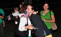 Spouses of aircrew from the 335th Fighter Squadron console each other after the final F-15E Strike Eagle took-off near the runway, Sept. 14, 2011. The 335th FS began a six-month deployment to Southwest Asia in support of Operation Enduring Freedom. The will join the 455th Air Expeditionary Squadron and provide close air support for more than 70,000 Soldiers, Sailors, Airmen and Marines. (U.S. Air Force photo by Senior Airman Marissa Tucker)