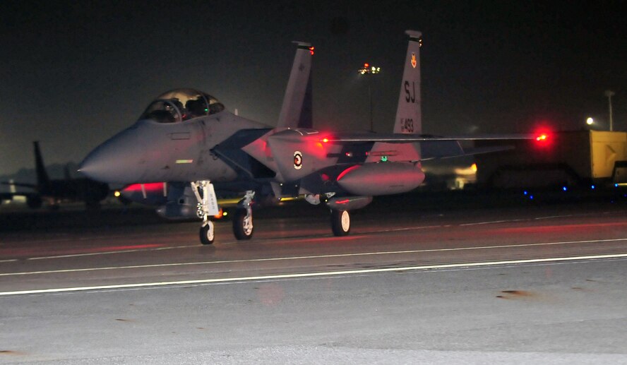 An F-15E Strike Eagle prepares to take off for a deployment to Southwest Asia, Sept. 14, 2011. The 335th Fighter Squadron will join more than 300 Airmen from Seymour Johnson Air Force Base, N.C., on a six-month deployment in support of Operation Enduring Freedom. The aircrew will provide close air support and conduct surveillance missions throughout Afghanistan. (U.S. Air Force photo by Senior Airman Marissa Tucker)