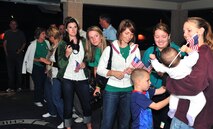 Families of pilots and weapon systems officers (WSO) from the 335th Fighter Squadron await the aircrew’s departure from the squadron for their deployment from Seymour Johnson Air Force Base, N.C., to Southwest Asia, Sept. 14, 2011. The aircrew will join the 455th Air Expeditionary Squadron, where they will provide close-air support for more than 70,000 Soldiers, Sailors, Airmen and Marines. (U.S. Air Force photo by Senior Airman Marissa Tucker)