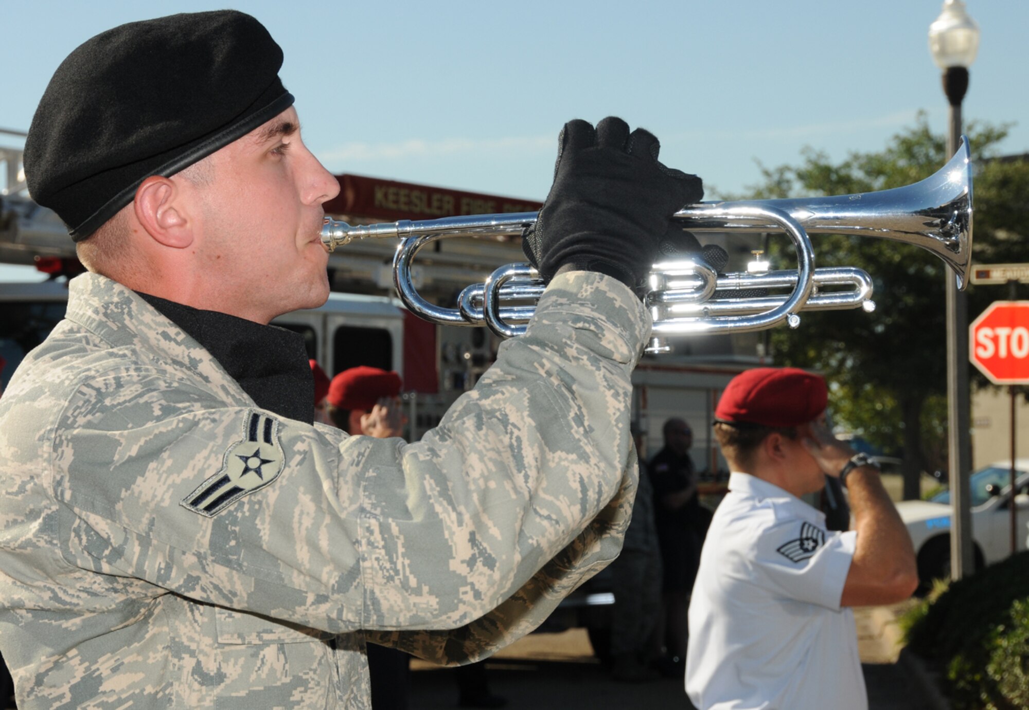 Airman 1st Class Andrew Hart, 338th Training Squadron student, plays Taps during Keesler’s 9/11 remembrance ceremony in front of wing headquarters Sept. 9.  Hart is a member of the 81st Training Group's drum and bugle corps.  (U.S. Air Force photo by Kemberly Groue)