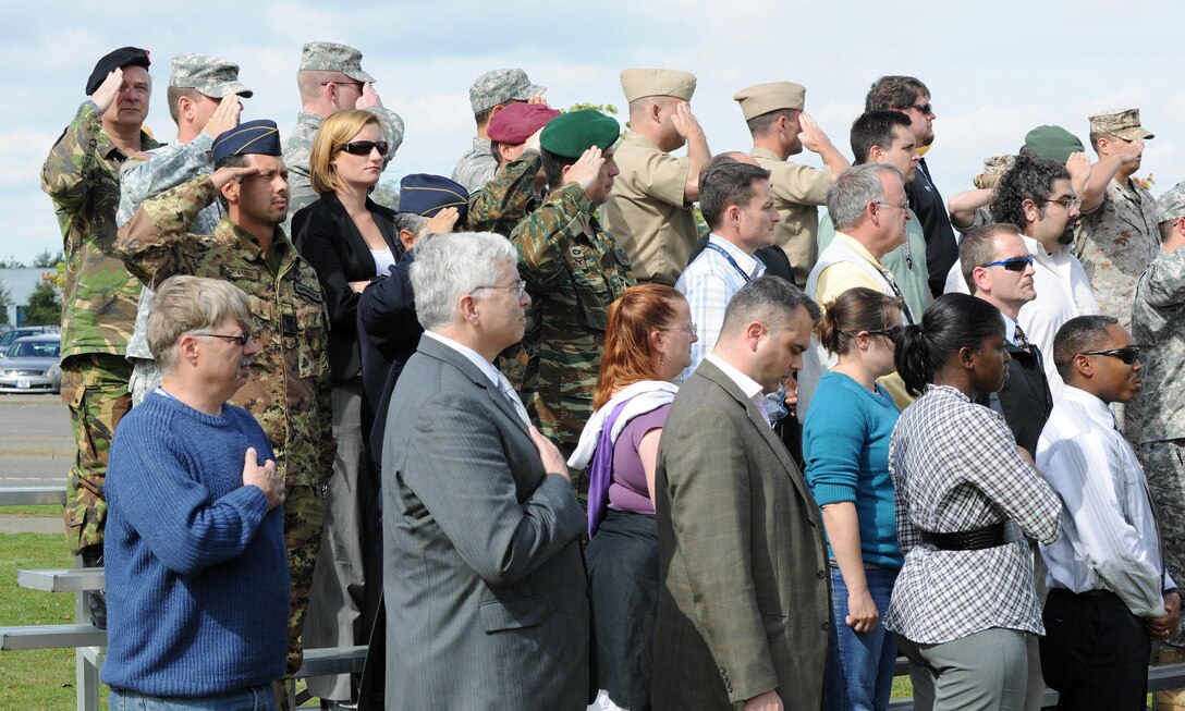RAF MOLESWORTH, United Kingdom - Members of the Molesworth community pay tribute to those who lost their life Sept. 11 during a ceremony here Sept. 9. (U.S. Air Force photo by Tech. Sgt. John Barton)