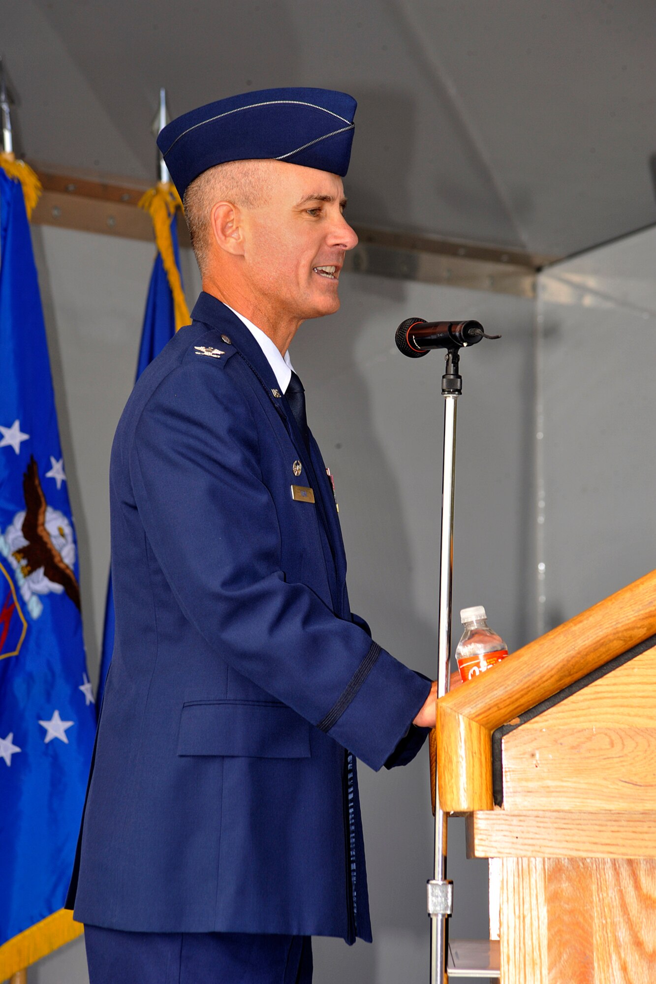 Col. Joe Turk, 721st Mission Support Group commander, makes opening remarks at the 9/11 artifact unveiling Sept. 12, 2011, at Cheyenne Mountain Air Force Station. The display was designed by a four-person team of University of Colorado-Colorado Springs students in conjunction with the 721st Civil Engineering Division. The beam was recovered from the World Trade Center and is one of eight artifacts to be memorialized at each of the military installations in Colorado Springs and around the Colorado Springs area. (U.S. Air Force photo/Rob Bussard)