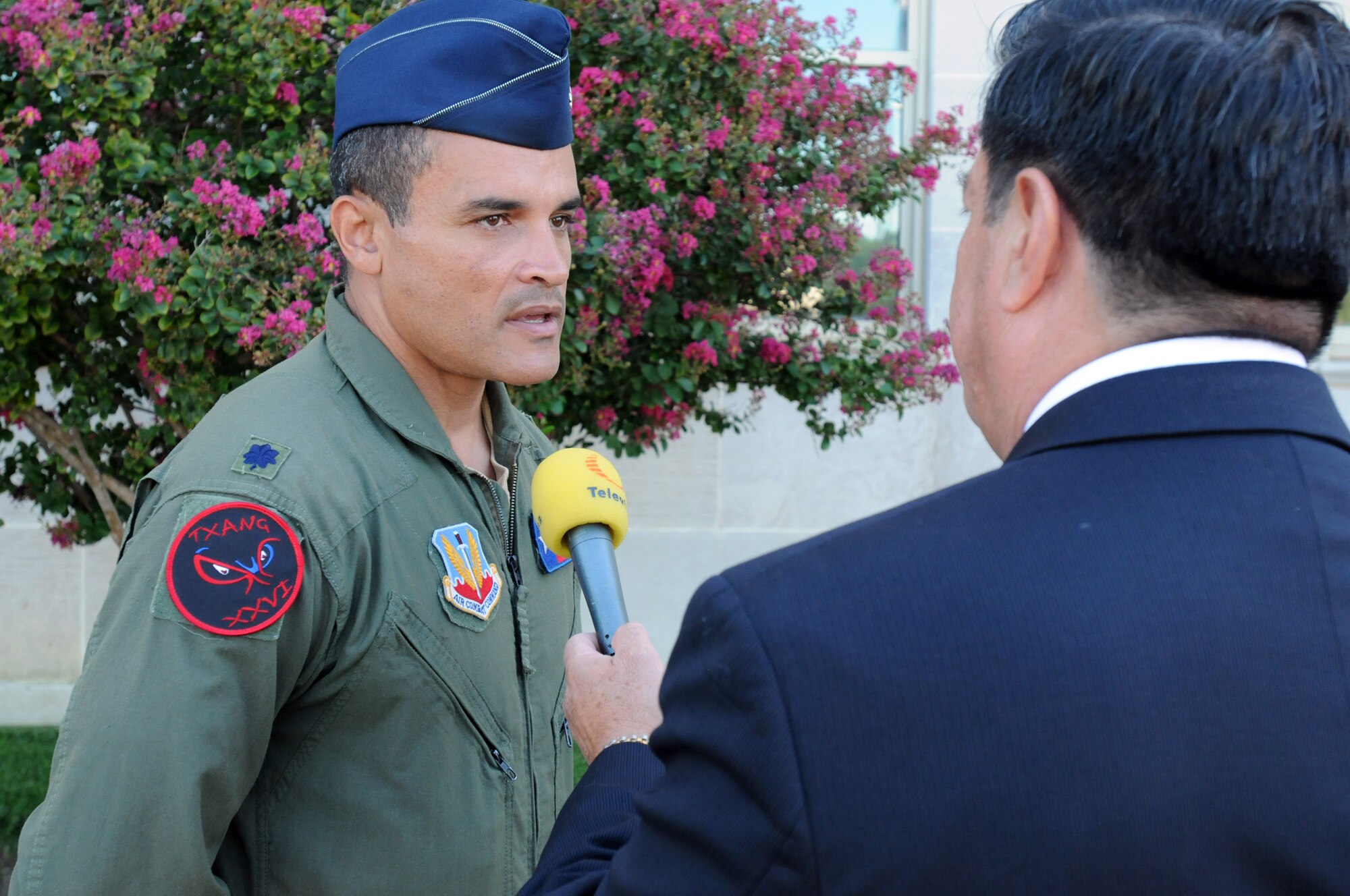 Air Force Lt. Col. Rolando Aguilar, Fairchild RC-26 Metroliner program manager for the 147th Reconnaissance Wing, Texas National Guard, participates in an interview during a 9/11 media-day event at Pentagon crash site Aug. 23, 2011, in Arlington, Va. Aguilar was one of several Guard members who gave interviews about their involvement with the 9/11 attacks. (U.S. Army photo by Sgt. Darron Salzer)(Released)