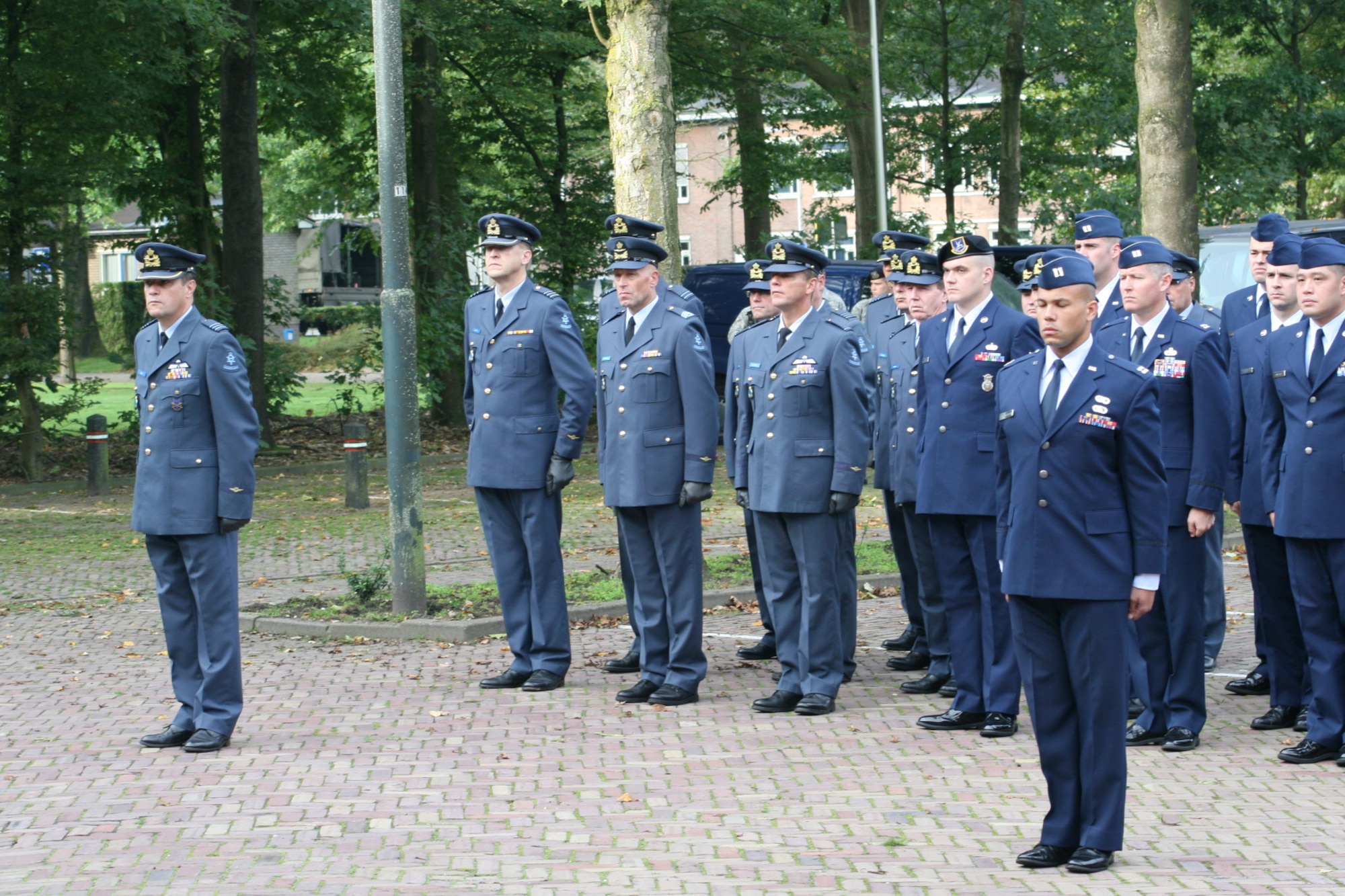 VOLKEL AIR BASE, Netherlands -- Airmen form Volkel Air Base stand in formation with members of the Royal Netherlands Air Force during a memorial ceremony Sept. 11 here. The ceremony was to commemorate the 10th anniversary of the Sept. 11, 2001 terrorist attacks on the U.S. Volkel Airmen and members of the Royal Netherlands air force came together to honor those who lost their lives in the 2001 attacks. (U.S. Air Force photo/ Senior Airman Raymond Duesbury)