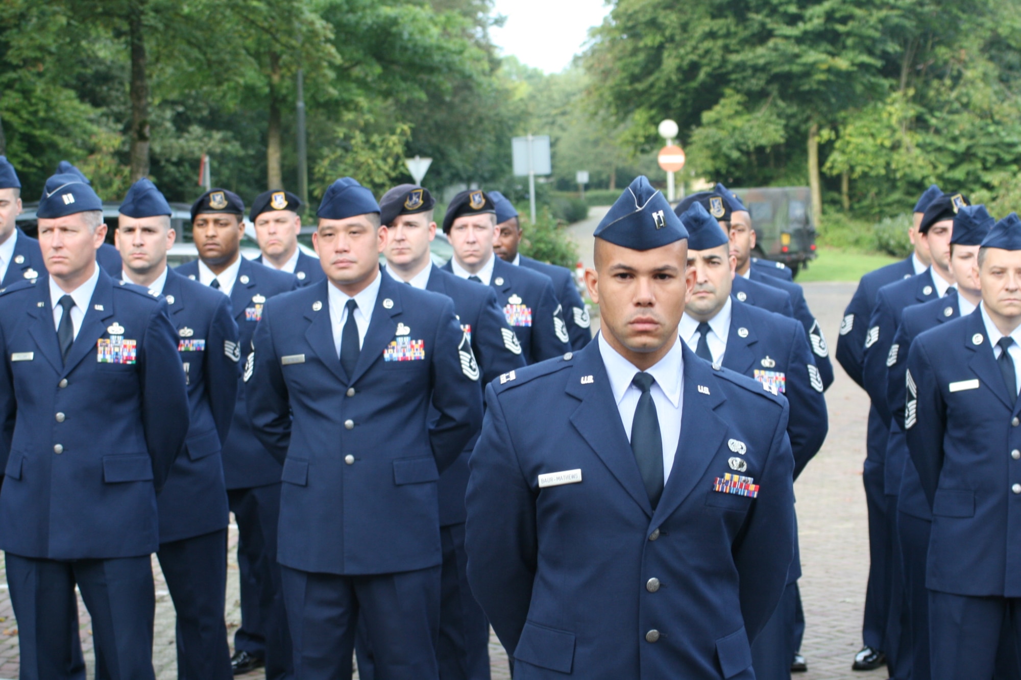 VOLKEL AIR BASE, Netherlands -- Airmen stand in formation during a memorial ceremony here Sept. 11. The ceremony was to commemorate 10th anniversary of the Sept. 11, 2001 terrorist attacks on the U.S. Volkel Airmen and members of the Royal Netherlands air force came together to honor those who lost their lives in the 2001 attacks. (U.S. Air Force photo/ Senior Airman Raymond Duesbury)