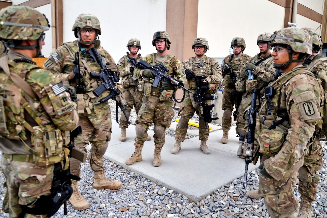 U.S. Army Capt. Jerry Mitchell briefs Force Protection Team Bravo as they prepare to relieve the fir