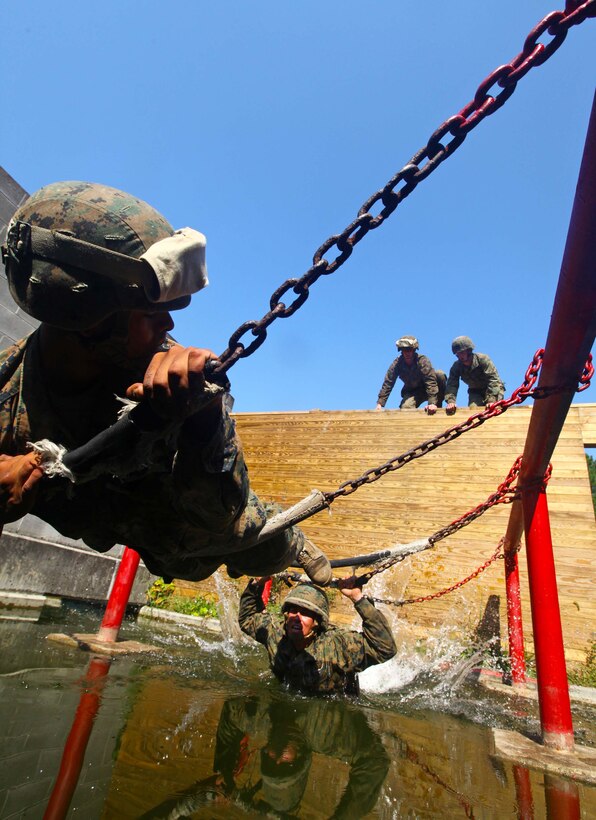 Marines and sailors of Charlie Company, 1st Battalion, 2nd Marine Regiment, conduct a leadership training exercise at the Leadership Reaction Course on Fort Pickett, Va., Sept. 14, 2011. More than 900 Marines and Sailors are taking part in the Deployment for Training exercise at Fort Pickett, Sept. 6-23. The battalion is scheduled to attach to the 24th Marine Expeditionary Unit as its Battalion Landing Team a few days after the training.