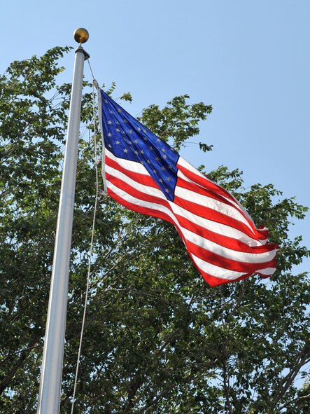 MOUNTAIN HOME AIR FORCE BASE, Idaho – A United States of America flag flies at the top of the flagpole here, Sept. 7. It is the universal custom to display the flag from sunrise to sunset on buildings and on stationary flagstaffs in the open. (U.S. Air Force photo by Airman 1st Class Heather Hayward)