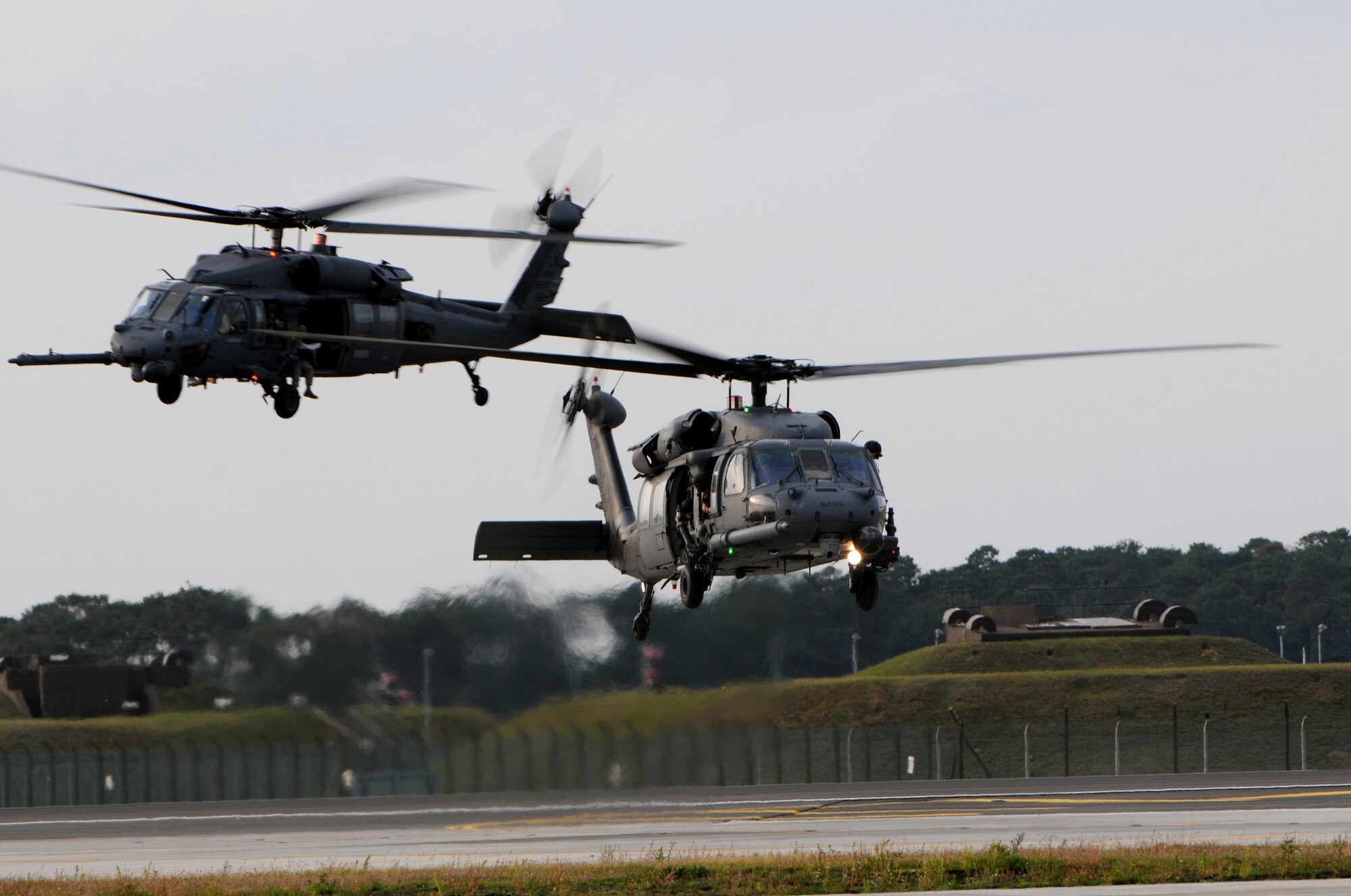 ROYAL AIR FORCE LAKENHEATH, England - Two HH-60G Pave Hawks prepare to land after returning from multiple deployments, September 15, 2011. Approximately 60 members from the 56th Rescue Squadron returned home after back-to-back deployments lasting more than nine months in support of Operations Enduring Freedom, Odyssey Dawn and Unified Protector.  The 56th RQS  is a combat-ready search and rescue squadron of HH-60G Pave Hawk helicopters capable of executing all-weather search and rescue missions day or night in hostile environments in support of the United States and its allies. (U.S. Air Force photo by Airman Cory D. Payne)
