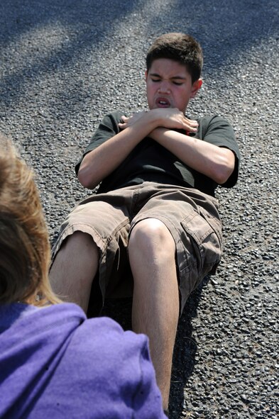 AJ Cedillo, 10th grader at The Academy of Technology, Engineering, Math and Science, Abilene, Texas does sit-ups Sept. 13, 2011, during his physical education class during Dyess Week. Dyess Week continues Dyess’ partnership with the Abilene community by supporting local schools’ fitness programs, educate the community on Dyess’ mission and raise awareness for the 64th anniversary of the Air Force’s birthday. (U.S. Air Force photo by Airman 1st Class Courtney Moses/Released) 