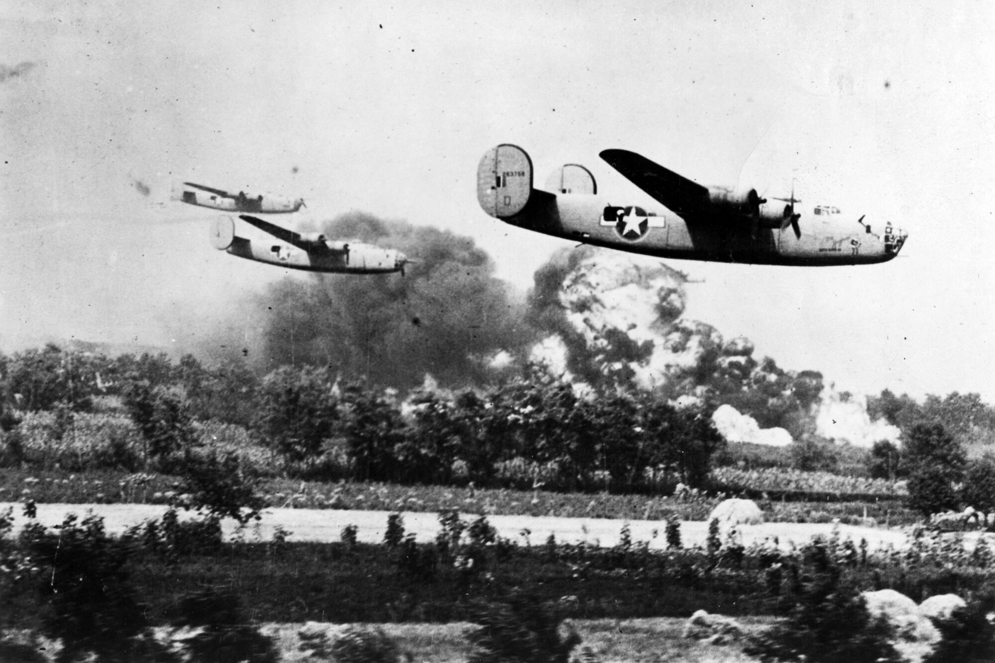 Three B-24 Liberator bombers, assigned to the 98th Bomb Group, fly a low-level bombing mission over the oil refineries around Ploesti, Romania, Aug. 1, 1943. The bomb group is holding a reunion in Shreveport, La., on Sept. 17 - 21, 2011, highlighting the achievements of the Ploesti Raiders. (Courtesy photo)