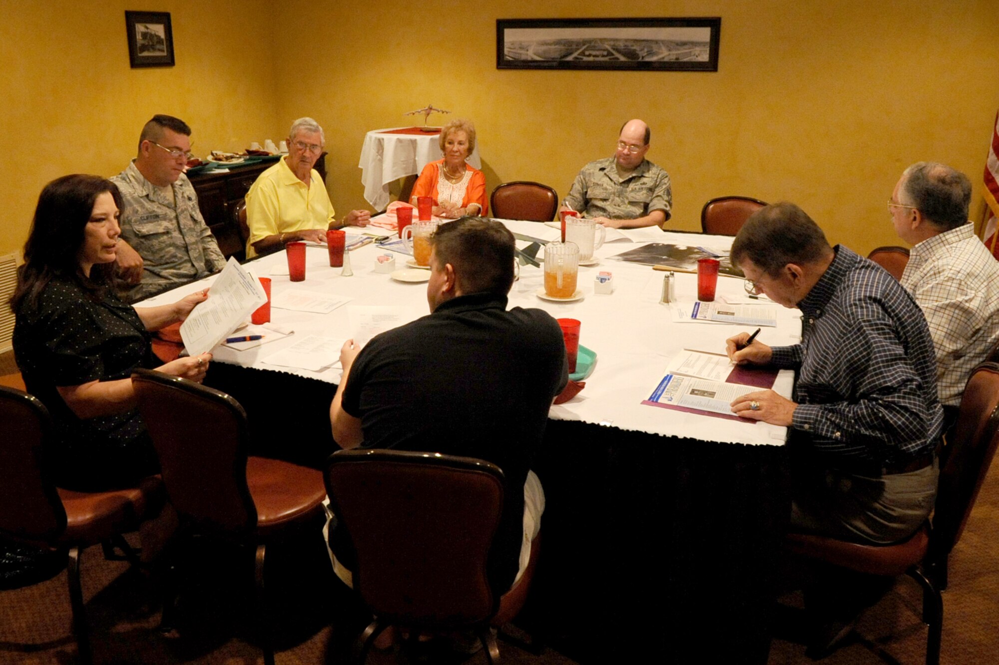 Members of the 98th Bomb Group/Wing reunion committee discuss event details at Barksdale Air Force Base, La., Sept. 14, 2011. Committee members include Jessica D'Aurizio, 307th Bomb Wing public affairs chief, Master Sgt. Donald Clifton, 2nd Security Forces Squadron, Dennis Posey, reunion coordinator, and wife Peggy, Tech. Sgt. Brian Stives, 8th Air Force public affairs, Robert Miller, 8th Air Force Museum curator, retired Brig. Gen. Peyton Cole, and Capt. Mark Bradle, 20th Bomb Squadron B-52 navigator. The reunion is scheduled for Oct. 17 - 21, 2011, and attendees will be treated to a tour of Barksdale. (U.S. Air Force photo by Master Sgt. Greg Steele/Released)