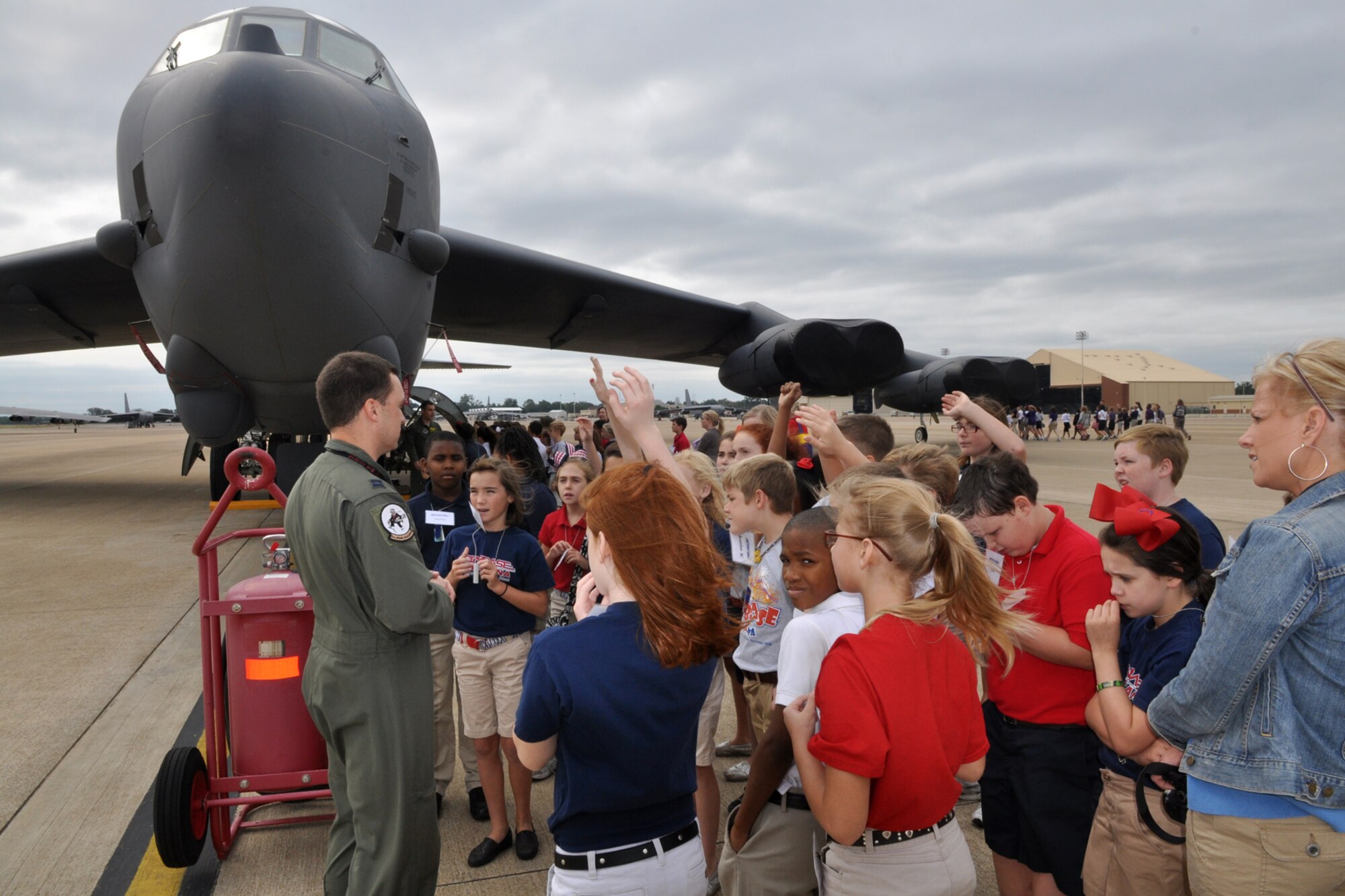 Capt. Richard Sandwick, an instructor navigator assigned to the 11th Bomb Squadron, discusses B-52 Stratofortress capabilities with a group of Benton Elementary 5th Grade students at Barksdale Air Force Base, La., Sept. 15, 2011. The students are participating in the STARBASE program, which presents an exciting 25-hour hands on/minds on aviation and aerospace curriculum to area 5th grade students and their teachers. (U.S. Air Force photo by Tech. Sgt. Jeff Walston/Released)