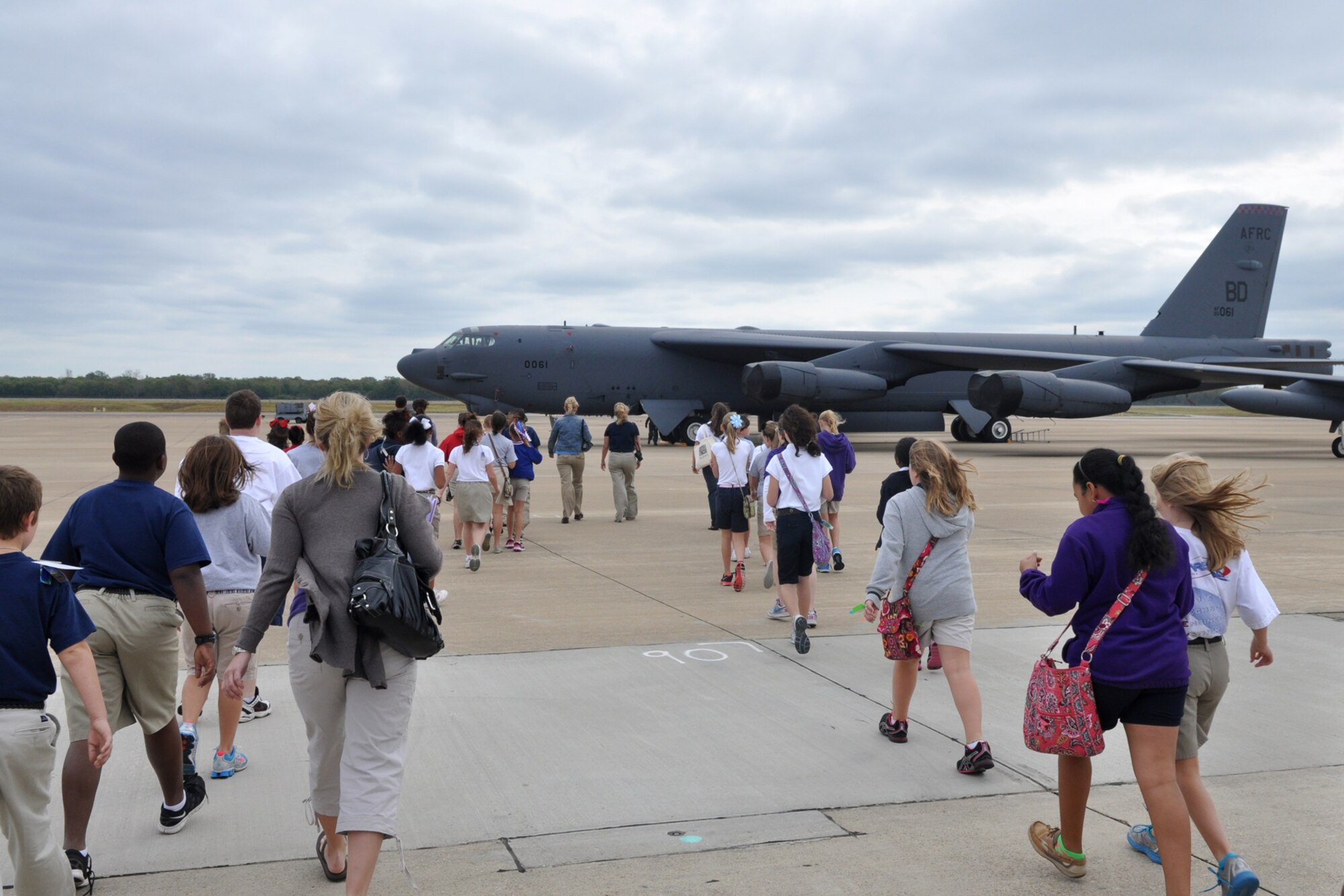 A group of approximately 75 Bossier Parish 5th Grade students hike out to a B-52 Stratofortress at Barksdale Air Force Base, La., Sept. 15, 2011. The students are attending STARBASE Louisiana, at Barksdale, one of 60 national STARBASE sites. It is sponsored by the 307th Bomb Wing of the Air Force Reserve Command. This particular briefing consisted of students from three separate classes, one from Princeton Elementary and the other two from Benton Elementary. (U.S. Air Force photo by Tech. Sgt. Jeff Walston/Released)