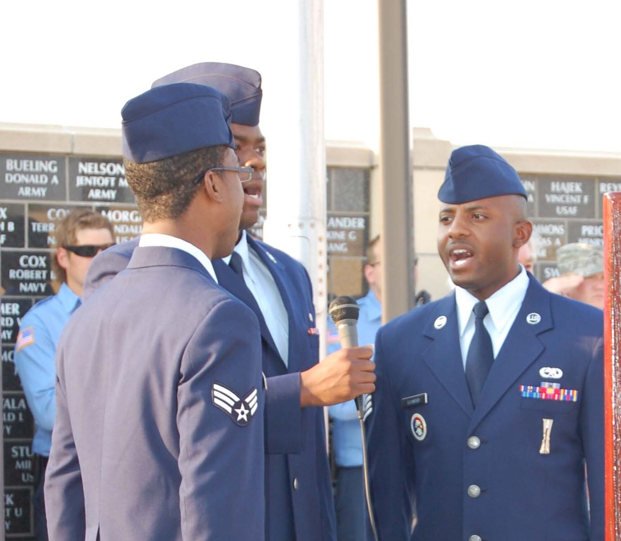 Three members of the Malmstrom Men's Ensemble perform the National Anthem following the presentation of the colors to start the ceremony marking the 10th Anniversary of 9/11 Sunday. (U.S. Air Force photo/Valerie Mullett)