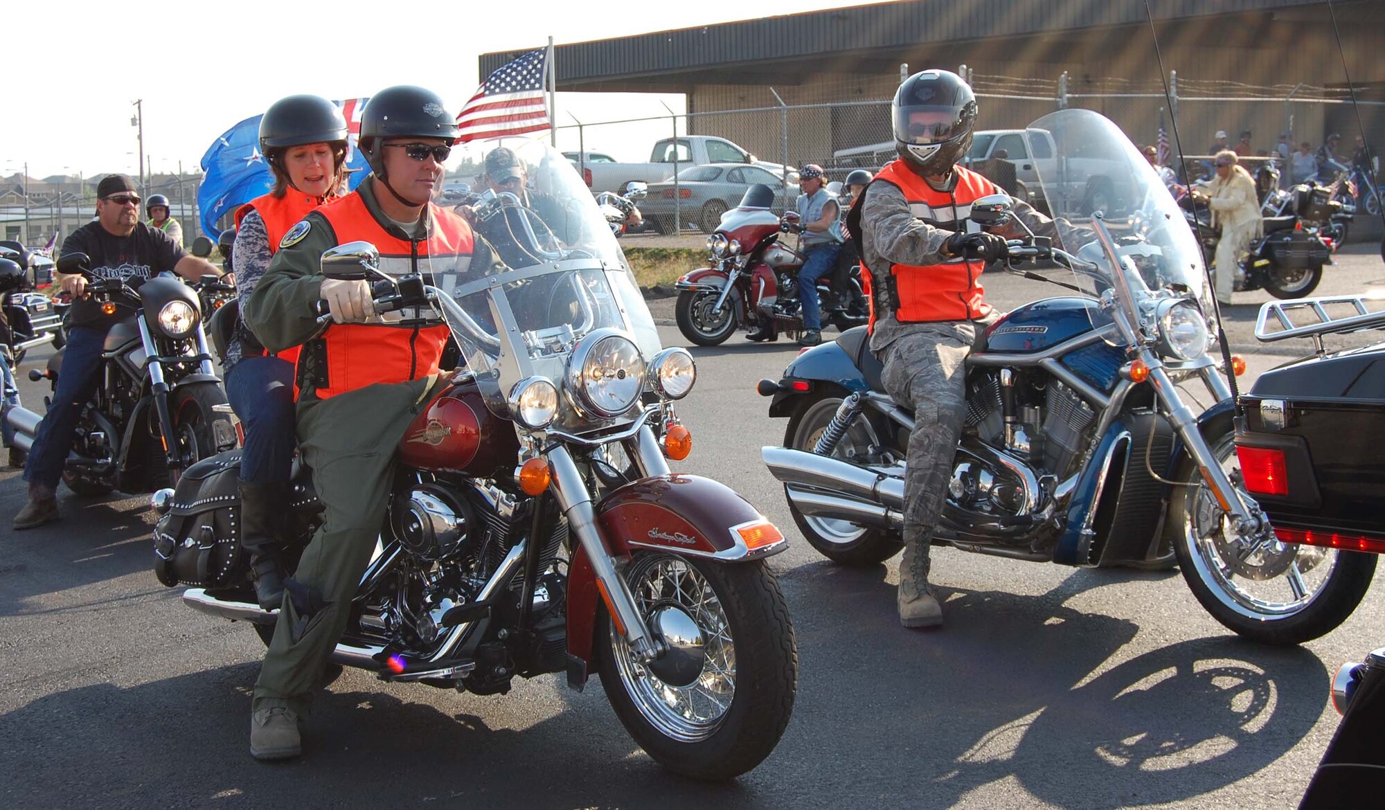 Col. Pete Hronek and his wife Traci, along with Col. Bruce Roehm, exit the Harley Davidson parking lot to begin the 10th Anniversary  9/11 Freedom Ride Sunday. Hronek is the 120th Fighter Wing commander and Roehm is the 341st Medical Group commander. (U.S. Air Force photo/Valerie Mullett)