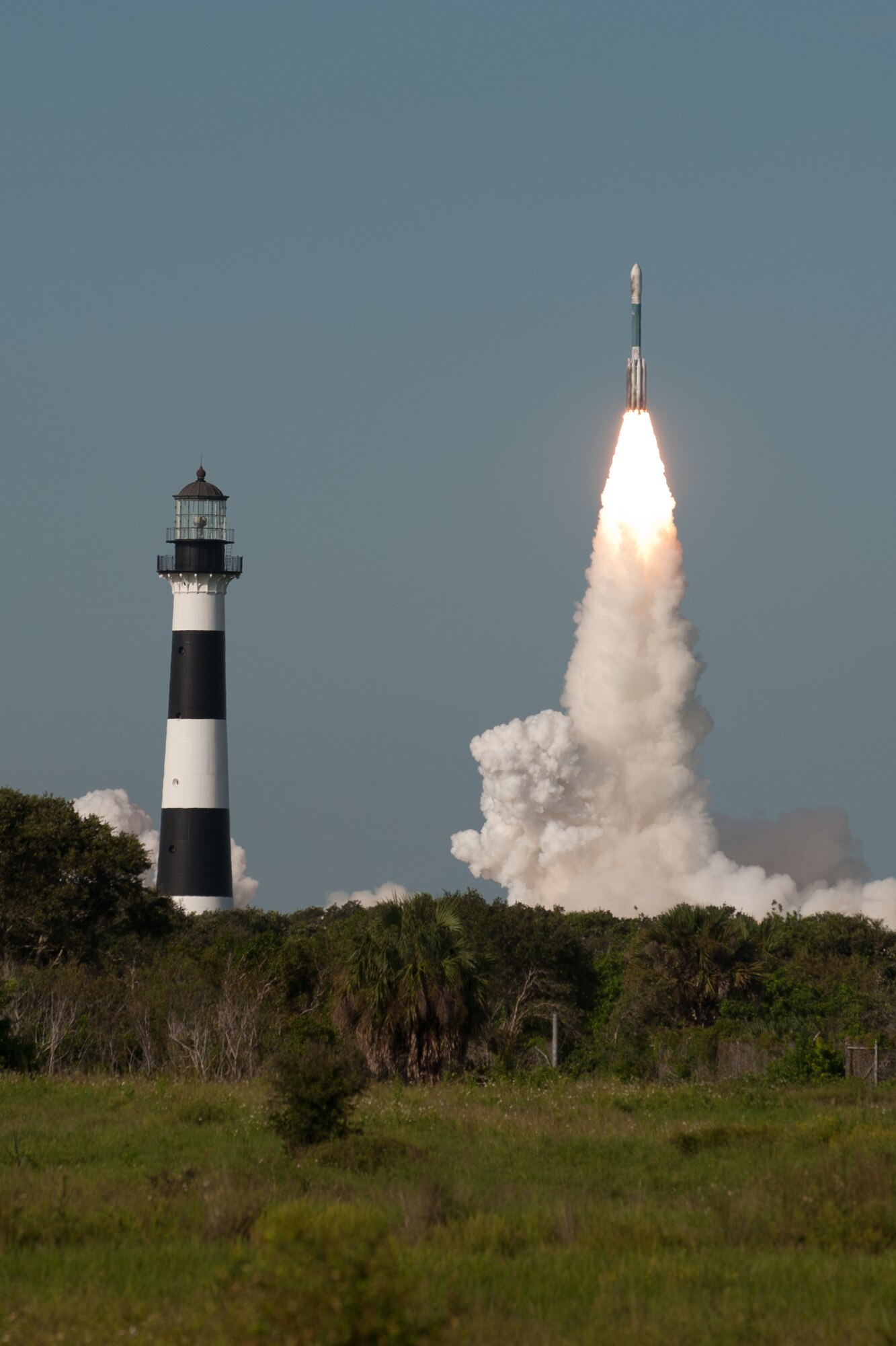 CAPE CANAVERAL AIR FORCE STATION, Fla. - A Delta II carrying NASA's Gravity Recovery and Interior Laboratory (GRAIL) launched Sept. 10, 2011, at 9:08 a.m. from Space Launch Complex 17, with Eastern Range support from the U.S. Air Force's 45th Space Wing. The Air Force's Cape Canaveral Lighthouse is pictured at left. GRAIL includes two spacecraft to study the moon's interior and thermal evolution. (Air Force photo/Tony Gray)