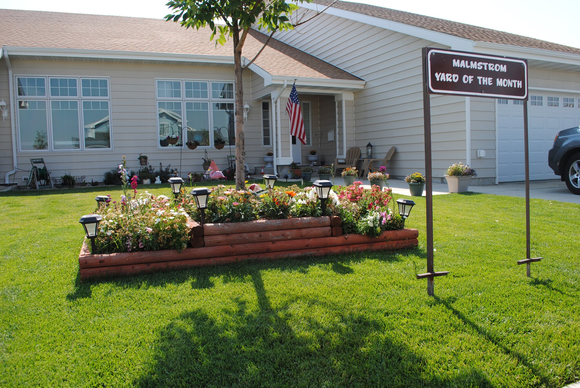 Pictured here is the residence of Tech Sgt. Robert Bertke, 341st Logistics Readiness Squadron NCO in charge of vehicle maintenance customer service, and his family at 7300 Filbert, Yard of the Month for August.  (U.S. Air Force photo/Airman 1st Class Katrina Heikkinen)