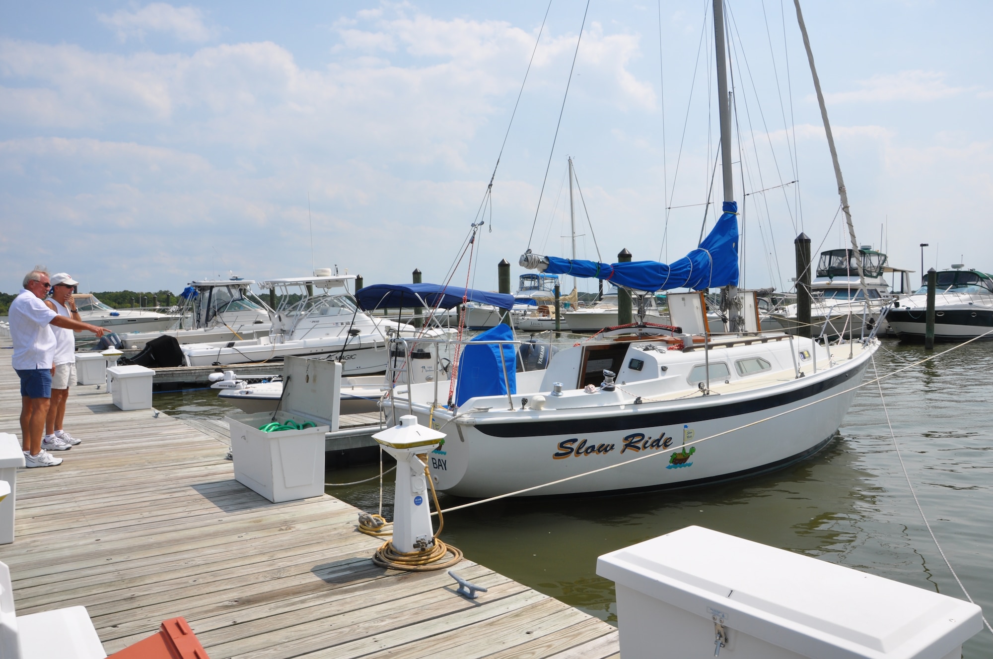 Larry Eason, Langley Marina manger, points out ways for retired Lt. Col. Jack Sornberger to tie his 27-foot Ericson Sail Boat ‘Slow Ride’ down Aug. 24 before Hurricane Irene struck Hampton Roads. The Langley Marina offers 75 wet slips and 95 dry slips to store boats for Department of Defense ID holders. (U.S. Air Force photo by Monica Miller-Rodgers/RELEASED)