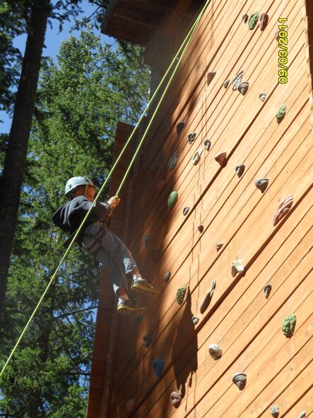Brennan Roshetko, 6-year-old, rappels down the Lazy F Camp climbing wall in Ellensburg, Wash. Sept. 12. The Fairchild CHapel put together the event to give families a chance to slow down. (U.S. Air Force photo/Col. Thomas Roshetko)