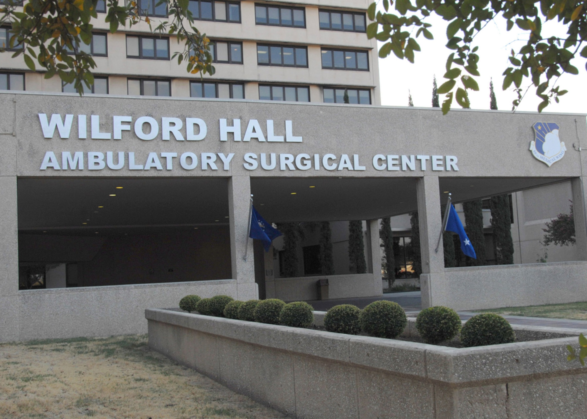 New signage for Wilford Hall Ambulatory Surgical Center, or WHASC, marks the official name change of the Air Force medical facility at Lackland Air Force Base, Texas. Wilford Hall transitioned from a Level 1 trauma center to an ambulatory surgical center as a result of the 2005 Base Realignment and Closure law, directing all of the hospital's inpatient care to move to Fort Sam Houston, Texas, by Sept. 15, 2011. The WHASC offers primary care; outpatient surgery; 24/7 urgent care for trainees and beneficiaries; medical, pediatric and surgical subspecialty clinics; Diabetes, Hearing and Eye Centers of Excellence; and a Contingency Aeromedical Staging Facility. (U.S. Air Force photo by Harold China)