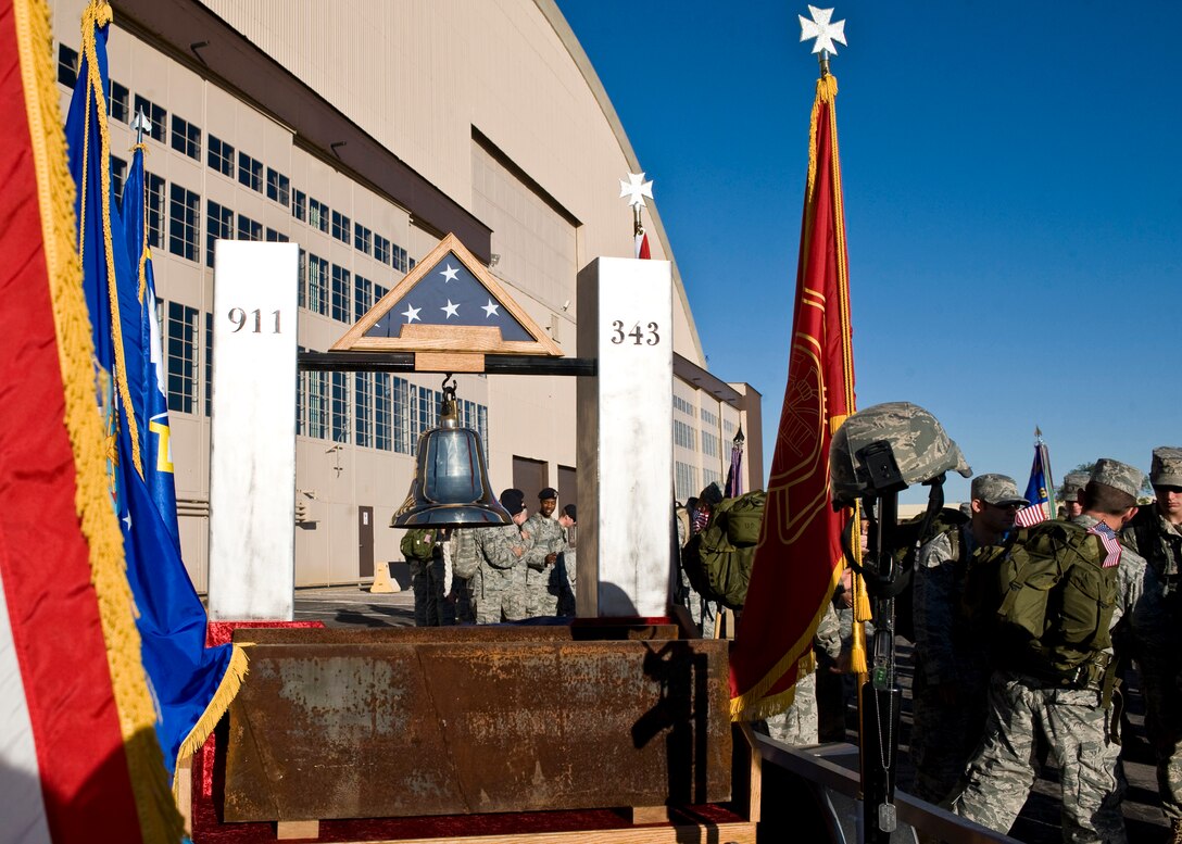 Airmen, friends, and family gather in front of the Pride Hangar for the 9/11 Ruck March to Remember at Ellsworth Air Force Base, S.D., Sept. 10, 2011. A float that included a piece of steel I-beam from one of the Twin Towers led the procession of marchers on the 10-mile trek. (U.S. Air Force photo by Airman Alystria Maurer/Released)