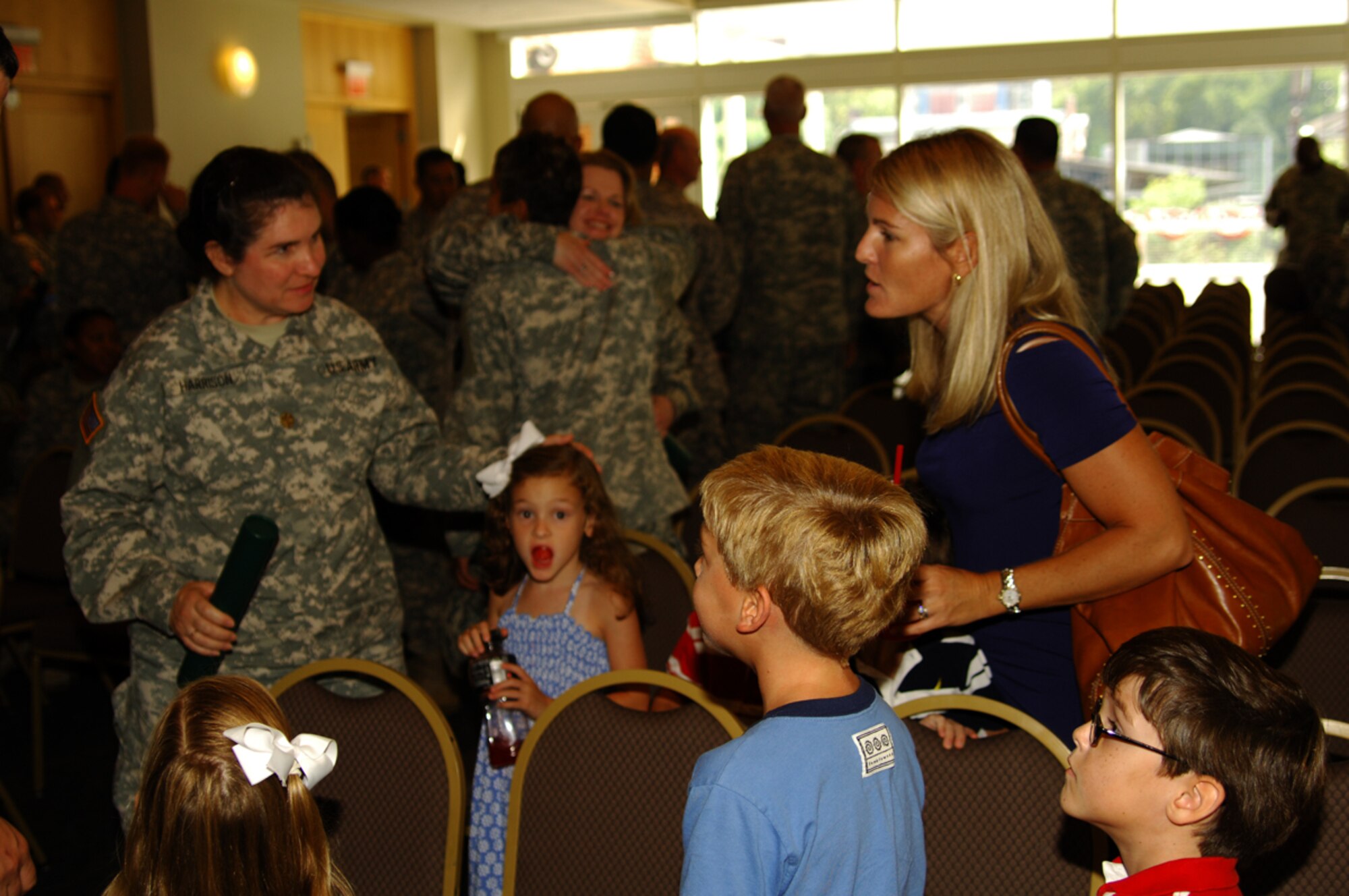 Maj. Alecia Harrison, of the 3274th Army Hospital, Fort Bragg, N.C., is congratulated by Crystal Cook, and her nephews and niece before venturing out to the streets of historic Philadelphia. (U.S. Army photo by David Moore/Released)
