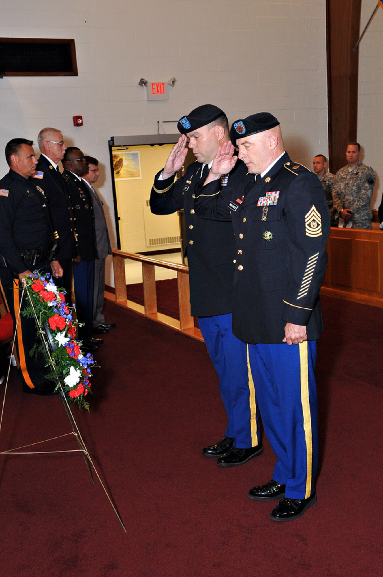 Army Support Activity-Dix Commander Col. Patrick J. Slowey and ASA-Dix Command Sgt. Maj. Steven Whittaker lay a wreath and give a salute during the 9/11 Memorial Ceremony Sept. 9 at the Soldier’s Chapel. More than 125 people attended the ceremony with the key speaker being Jim Kazalis, a U.S. Marine Corps veteran and World Trade Center south tower survivor. (U.S. Air Force photo by Wayne Russell/Released)