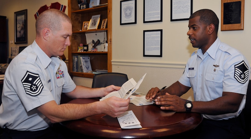 Master Sgt. Paul Grugin, left, 11th Civil Engineer Squadron first sergeant and Air Force Sergeants Association Chapter 102 president, chats with Master Sgt. Maurice Osborne, 1st Airlift Squadron flight attendant and AFSA legislative trustee, Sept. 12 about issues necessary for discussion at an upcoming AFSA meeting. Through legislative review, all issues brought to AFSA Chapter 102 members are evaluated by the special-interest group. (U.S. Air Force photo/Airman 1st Class Lindsey A. Beadle)