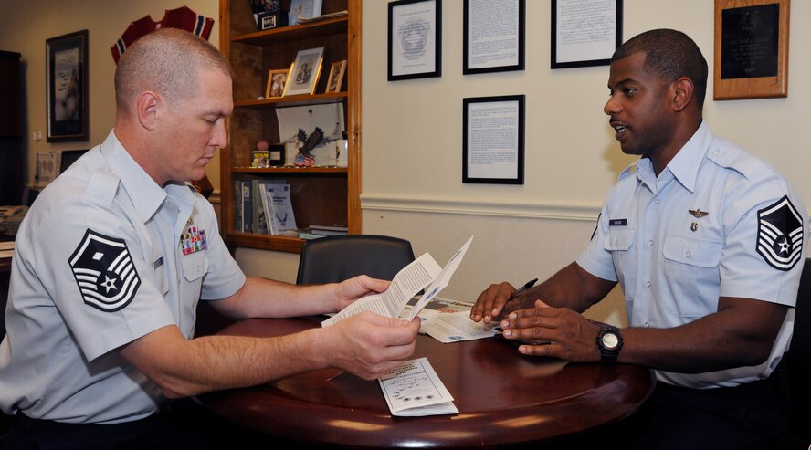 Master Sgt. Paul Grugin, left, 11th Civil Engineer Squadron first sergeant and Air Force Sergeants Association Chapter 102 president, chats with Master Sgt. Maurice Osborne, 1st Airlift Squadron flight attendant and AFSA legislative trustee, Sept. 12 about issues necessary for discussion at an upcoming AFSA meeting. Through legislative review, all issues brought to AFSA Chapter 102 members are evaluated by the special-interest group. (U.S. Air Force photo/Airman 1st Class Lindsey A. Beadle)