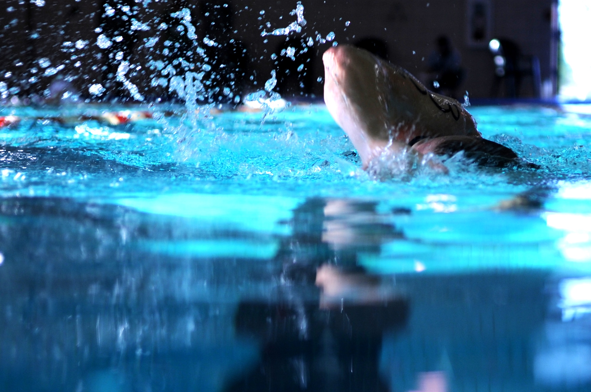 Capt. Matthew Moberg, 319th Medical Group, swims laps in the Grand Forks Air Force Base pool Sept. 10. The swimming pool on GFAFB is indoors with areas designated for lap swim and recreational swimming along with a spacious pool-side lounge area with comfortable seating. (U.S. Air Force photo/Senior Airman Amanda N. Stencil)