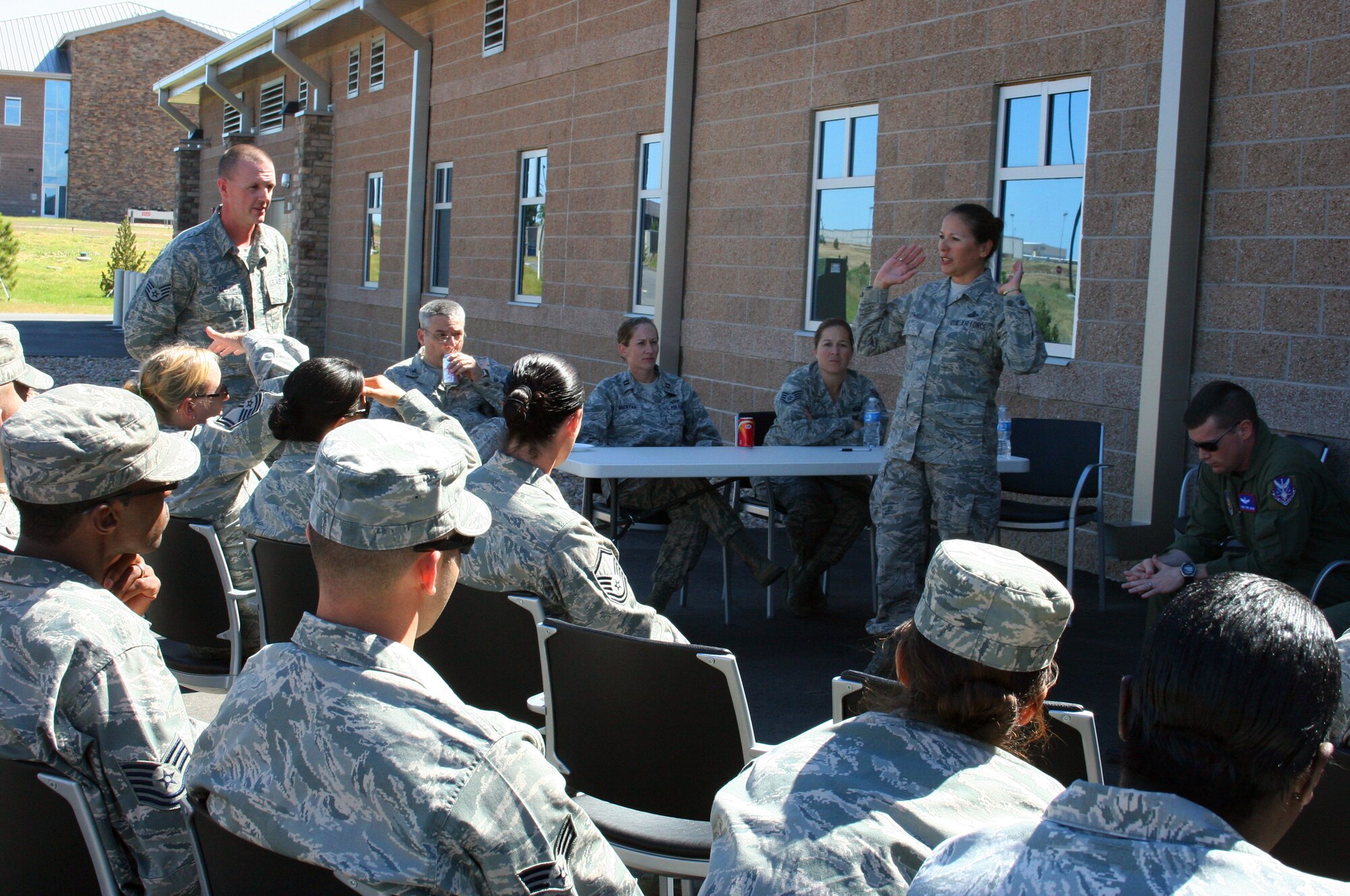 The northern and southern units of the 310th Space Wing took part in 9/11 remembrances on Sept. 11, 2011, at Buckley and Schriever Air Force Bases, Colo..
At Buckley Air Force Base, a panel discussion was held to discuss the infamous day, as well as to share its effects over the past decade. Panel member, Chief Master Sgt. Judy Schwald, right, recounted her experiences of that day. Also facilitating the panel were Staff Sgts. Conrad Jones and Aleena Floyd, Col. Todd Laughman and Capt. Tracy Maestas. (U.S. Air Force photo/Lt. Col. Cindy East)