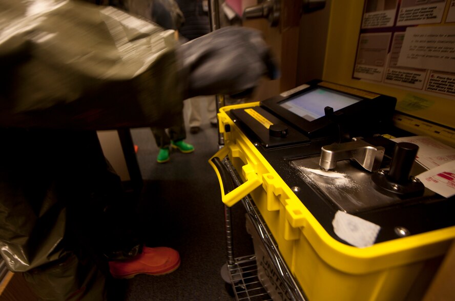 U.S. Air Force Airmen from the 23rd Aerospace Medical Squadron bioenvironmental engineering flight use a hazardous material identification machine (HazMatID) to test a white powdery substance found in a mail room during a training exercise at Moody Air Force Base, Ga., Sept. 14, 2011. The HazMatID is a fully portable instrument for on-site chemical analysis. (U.S. Air Force photo by Airman 1st Class Joshua Green)
