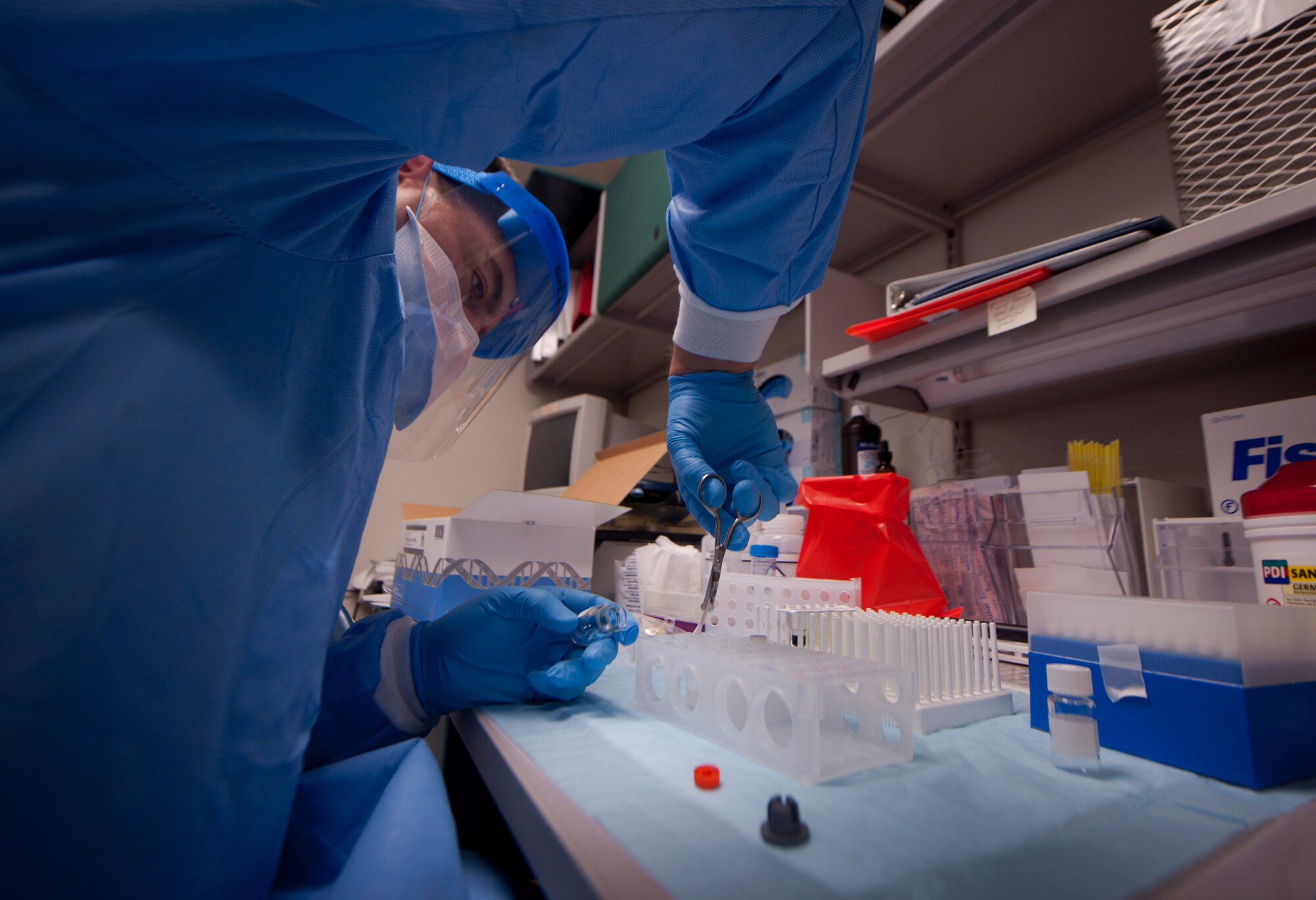 U.S. Air Force 1st Lt. Ryan Garrison, 23rd Medical Group clinical imaging diagnostic flight chief, uses a Q-tip swab to test a white powdery substance found in a mail room during a training exercise at Moody Air Force Base, Ga., Sept. 14, 2011. Garrison’s job is to run preliminary test on the substance to locate possible contaminants within the substance. (U.S. Air Force photo by Airman 1st Class Joshua Green)
