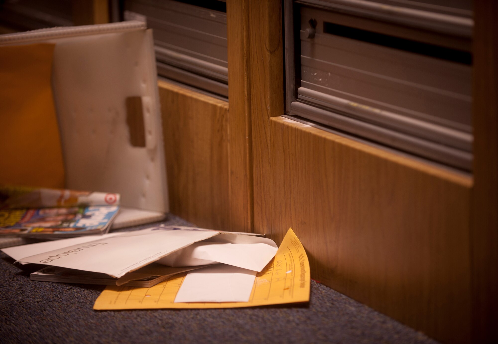 Envelopes, magazines and a white powdery substance are found in a mail room during a training exercise for the 23rd Aerospace Medical Squadron bioenvironmental engineering flight at Moody Air Force Base, Ga., Sept. 14, 2011. The flight was tasked to locate the material, decipher what type of contaminate it was and send to the base lab for further inspection. (U.S. Air Force photo by Airman 1st Class Joshua Green)
