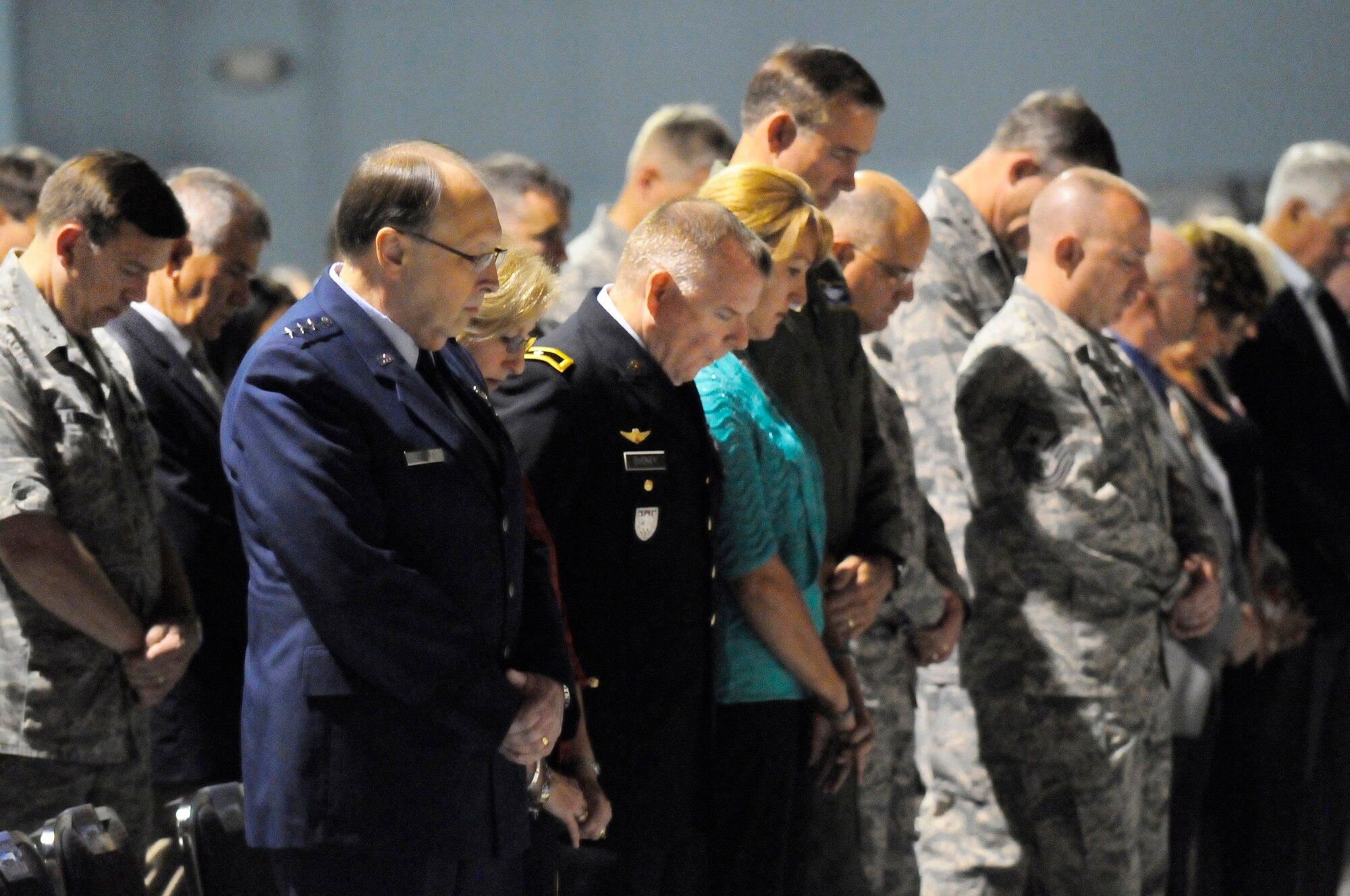 Attendees bow their heads for a moment of silence at the Sept. 11 remembrance ceremony at the Museum of Aviation. U. S. Air Force photo by Sue Sapp