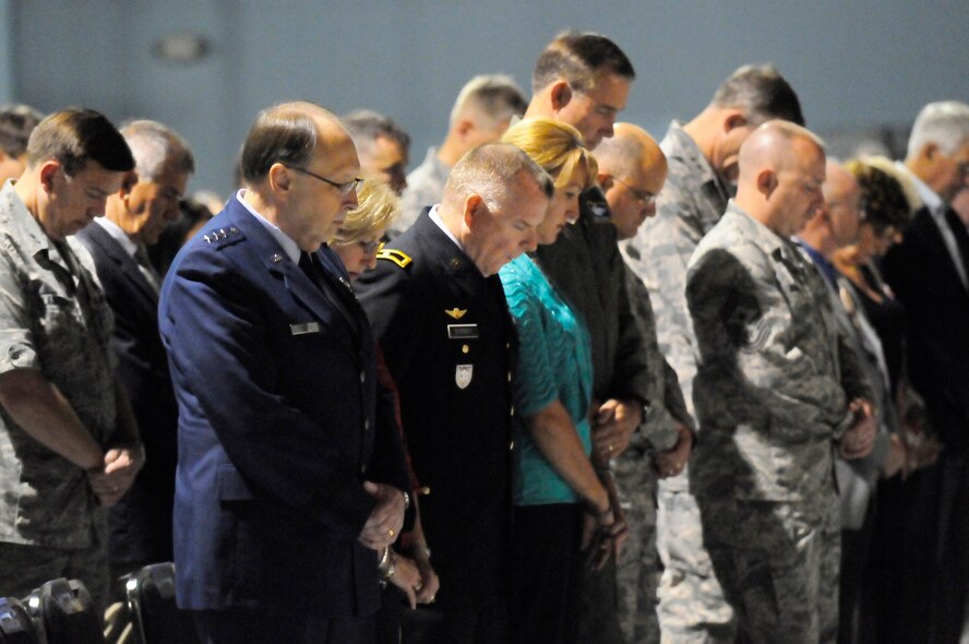 Attendees at the Robins Sept.11 commemoration bow their heads for a moment of silence. This year marked the 10th anniversary of the attacks. U. S. Air Force photo by Sue Sapp 

