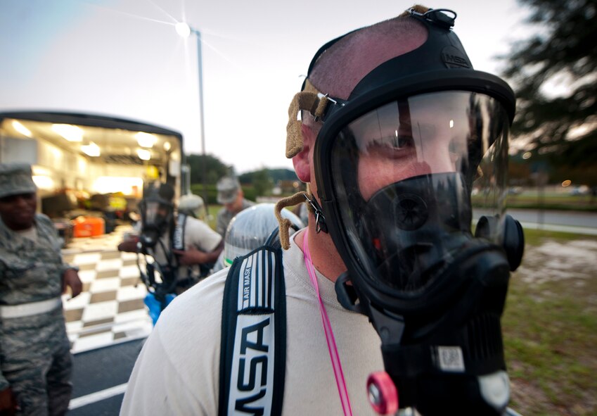 U.S. Air Force Staff Sgt. Anthony Richey, a 23rd Aerospace Medical Squadron bioenvironmental engineering technician, has his chemical gear checked before entering a contaminated building during a training exercise at Moody Air Force Base, Ga., Sept. 14, 2011. The scenario for the training exercise was anthrax being found in a mail room. (U.S. Air Force photo by Airman 1st Class Joshua Green)
