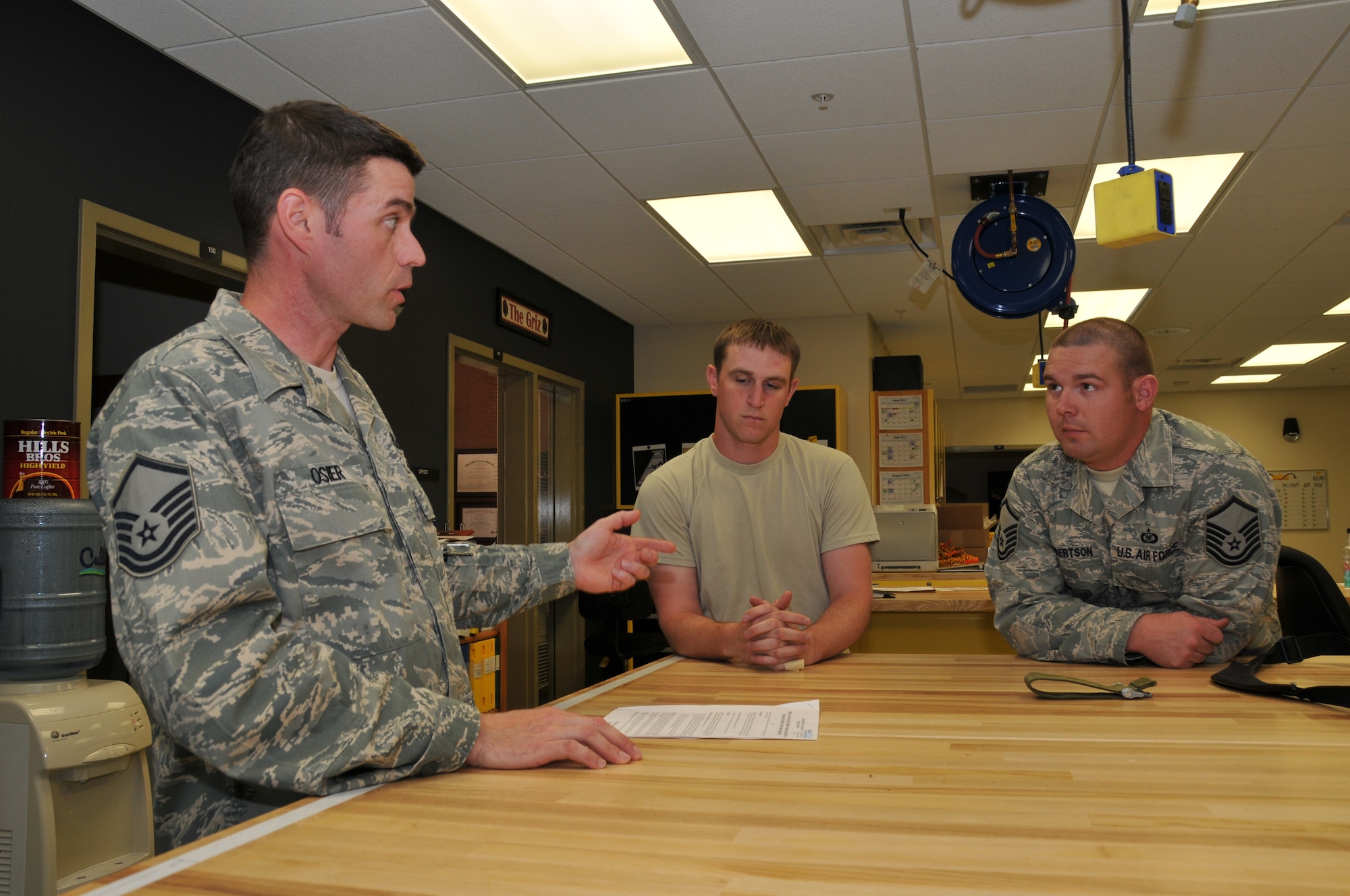 120th Fighter Wing Master Sgt. Bob Osier discusses the days events with Master Sgt Raegen Robertson in the Aircrew Flight Equipment section on June 24, 2011.
(U.S. Air Force photo by Senior Master Sgt. Eric Peterson.)