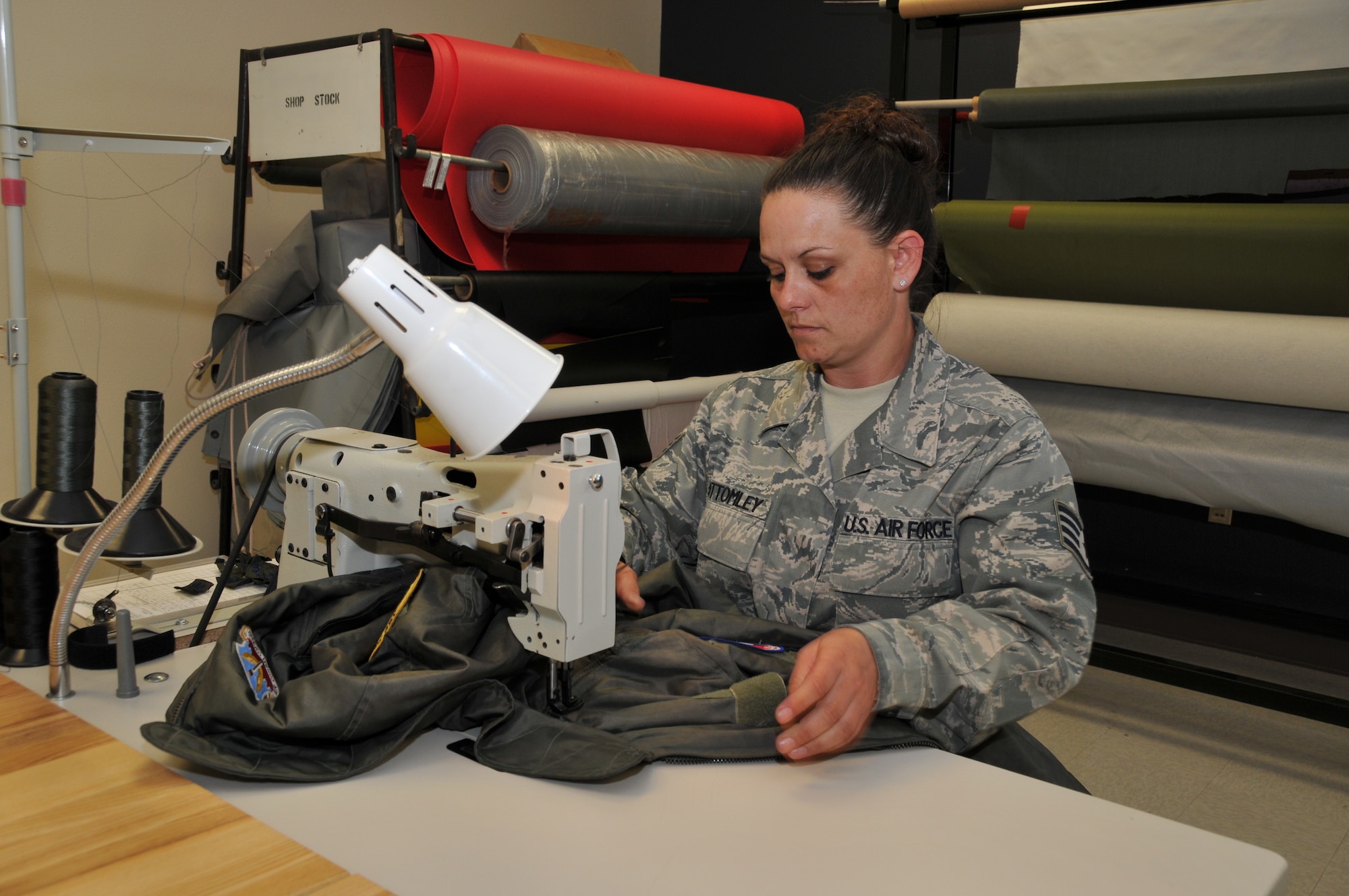 120th Fighter Wing Staff Sgt. Naomy Bottomley works on a piece of flight clothing in the Aircrew Flight Equipment section on June 23, 2011. 
(U.S. Air Force photo by Senior Master Sgt. Eric Peterson.)