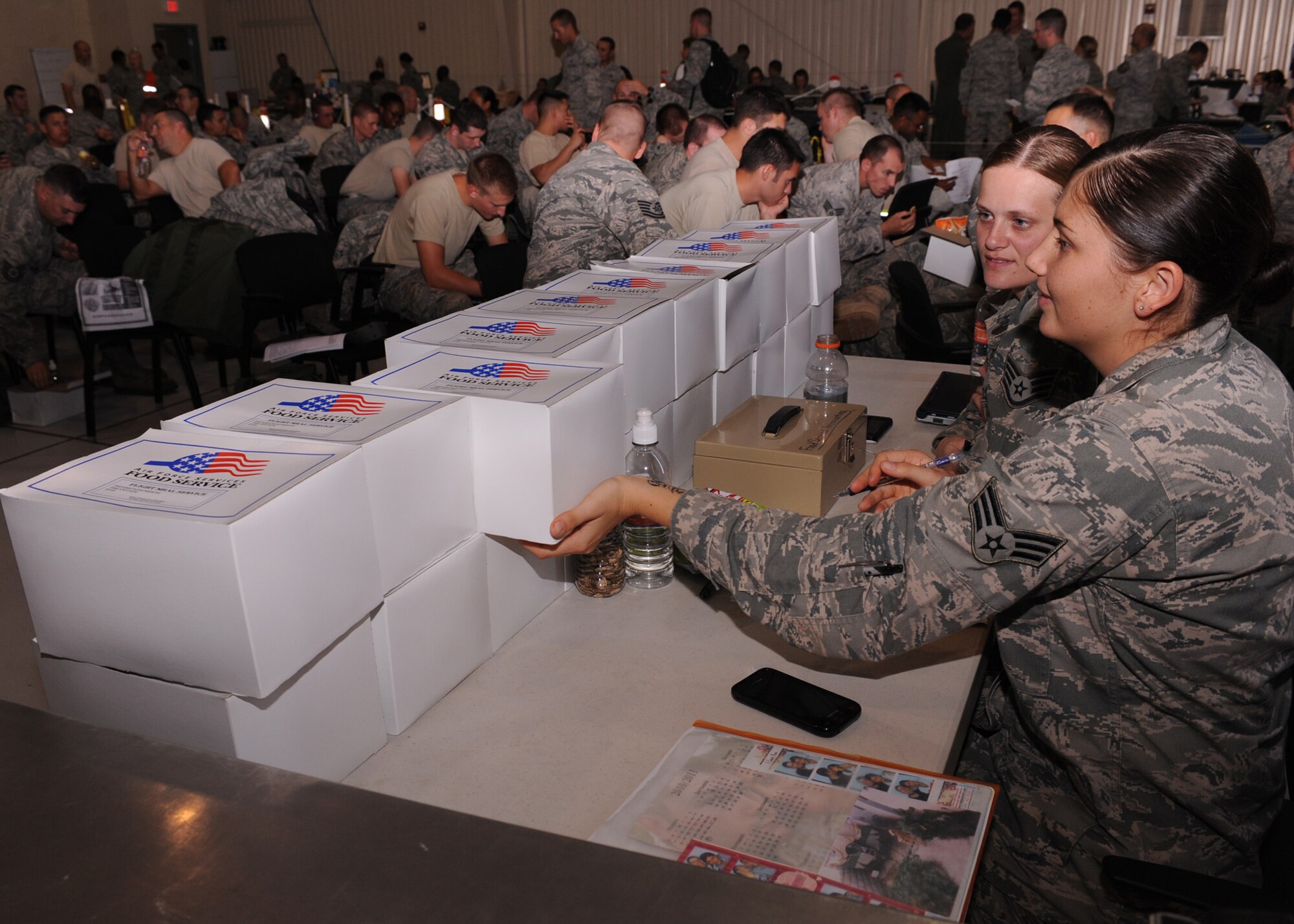 DAVIS-MONTHAN AIR FORCE BASE, Ariz. – Senior Airman Rebecca Maher and Staff Sgt. Danielle Jetton from the 355th Force Support Squadron, wait to sell food service meals during the operational readiness exercise here Sept. 13. (U.S. Air Force photo/Airman 1st Class Christine Halan)