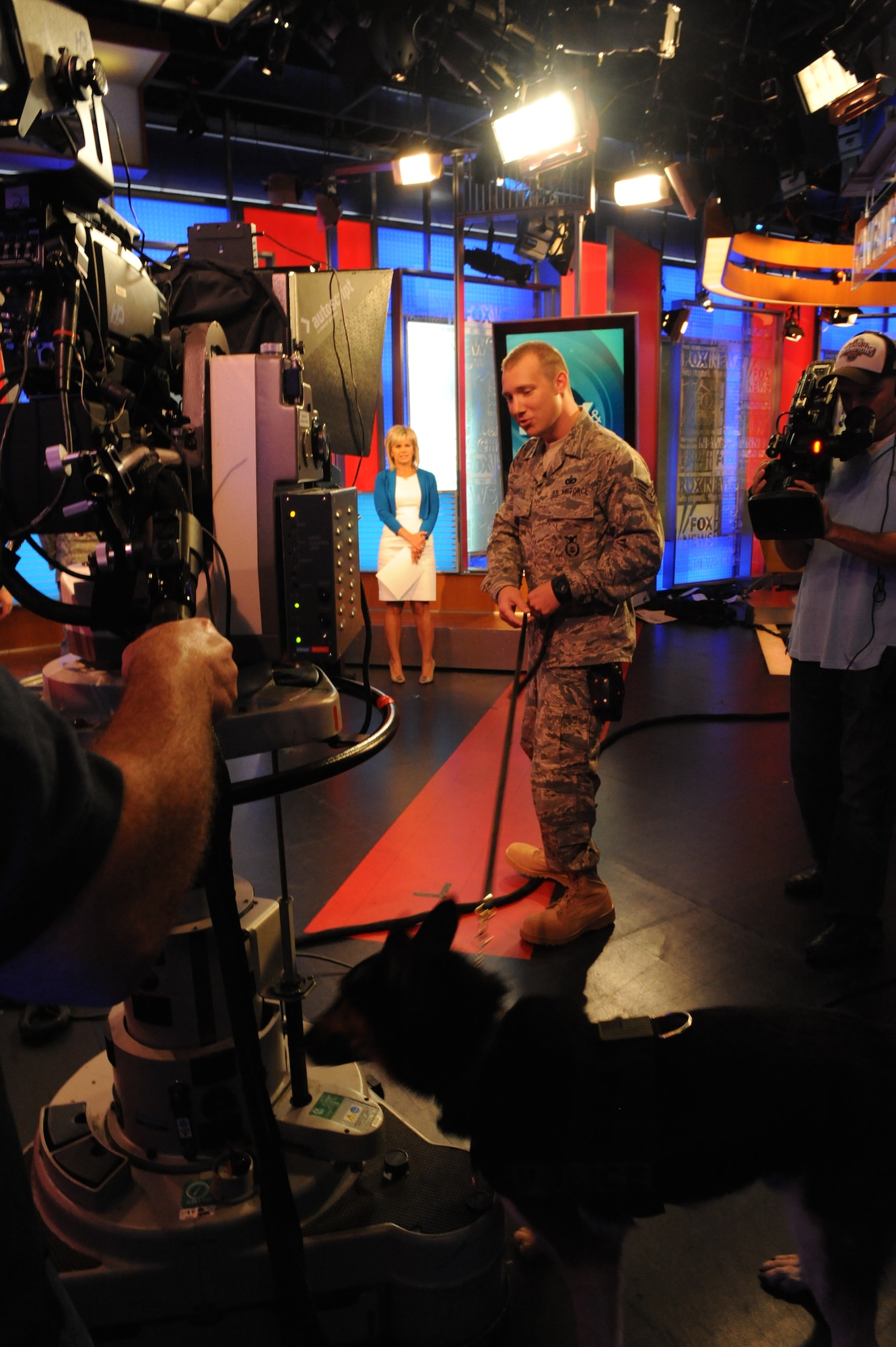 Staff Sgt. Benjamin Seekell and military working dog Charlie, both wounded warriors, demonstrate the capabilities of patrol explosives dogs at the FOX and Friends studio in New York Sept. 12, 2011.  Seekell and Charlie were wounded by an improvised explosive device outside Bagram Airfield, Afghanistan on Mother’s Day 2011.  Seekell joined other Airmen from the 4th Security Forces Squadron to speak about their time in the Air Force as well as the creation and completion of the Security Forces 9/11 Ruck March to Remember. (U.S. Air Force photo by 2nd Lieutenant Keavy Rake)