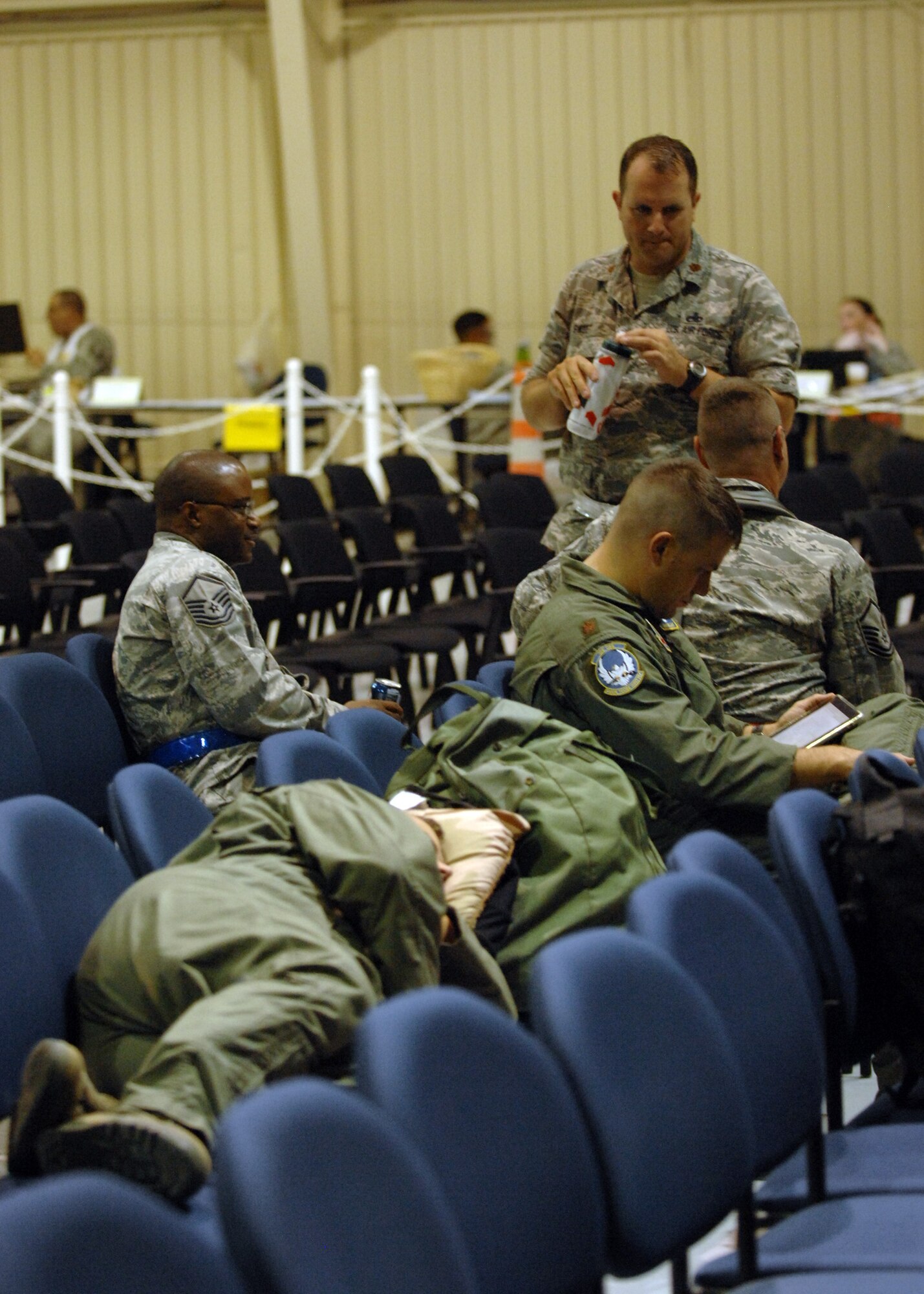 DAVIS-MONTHAN AIR FORCE BASE, Ariz. – Airmen from the 355th Fighter Wing rest in the sanitized area during the operational readiness exercise here Sept. 13. After going through the processing line, deploying Airmen relax and wait in the sanitized area until they leave. (U.S. Air Force photo/Airman 1st Class Timothy D. Moore)