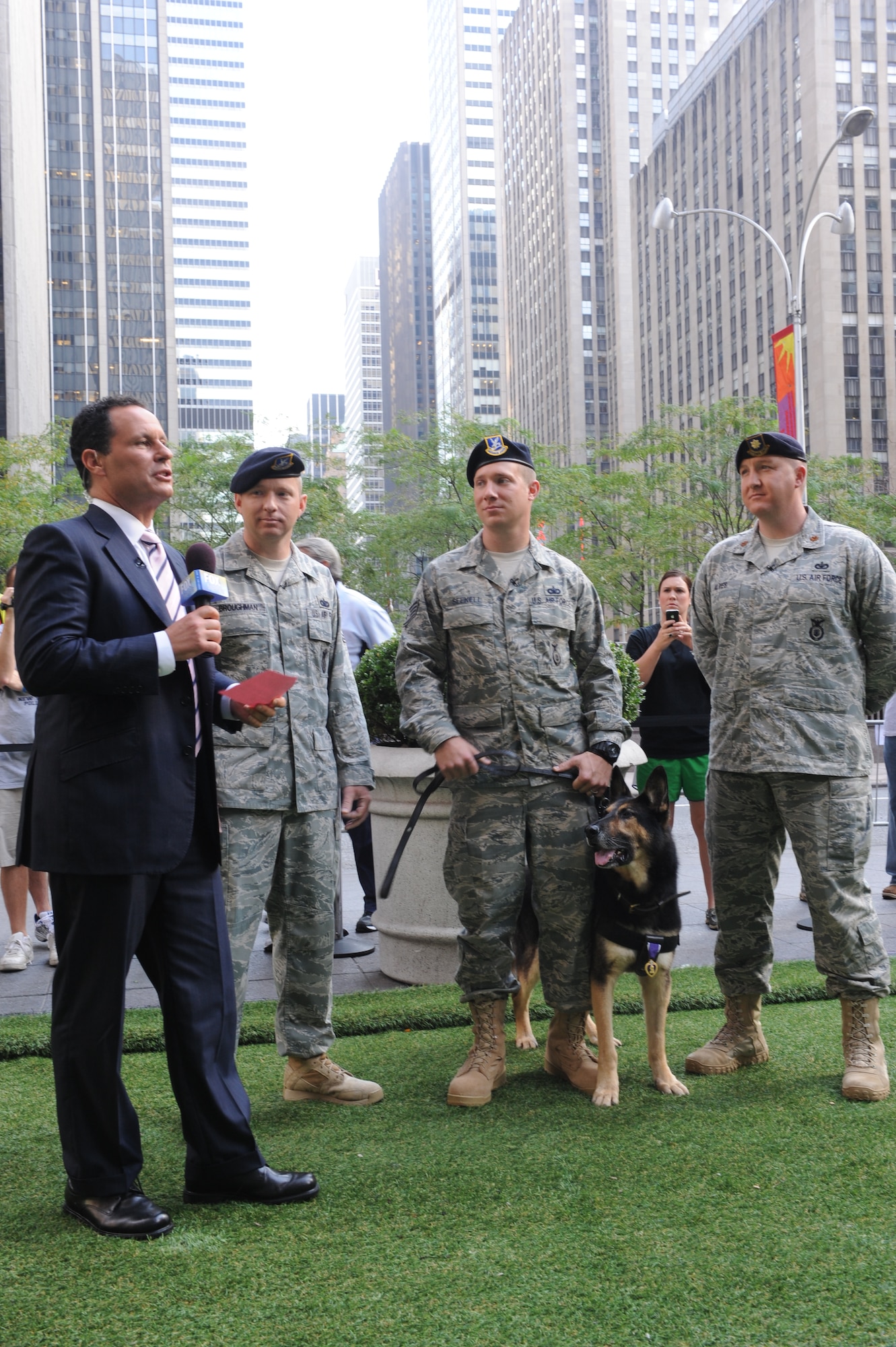 A team of defenders from the 4th Security Forces Squadron stationed at Seymour Johnson Air Force Base, N.C. speak with Brian Kilmeade anchor of FOX and Friends in New York Sept. 12, 2011.  Tech. Sgt. Kenneth Broughman,left, Staff Sgt. Benjamin Seekell and Maj. Jim Alves talked about their time serving in the Air Force as well as their tribute to the 10th anniversary of 9/11 through the Security Forces Ruck March to Remember, which they created to commemorate the sacrifices of  those who serve their nation. (U.S. Air Force photo by 2nd Lieutenant Keavy Rake)