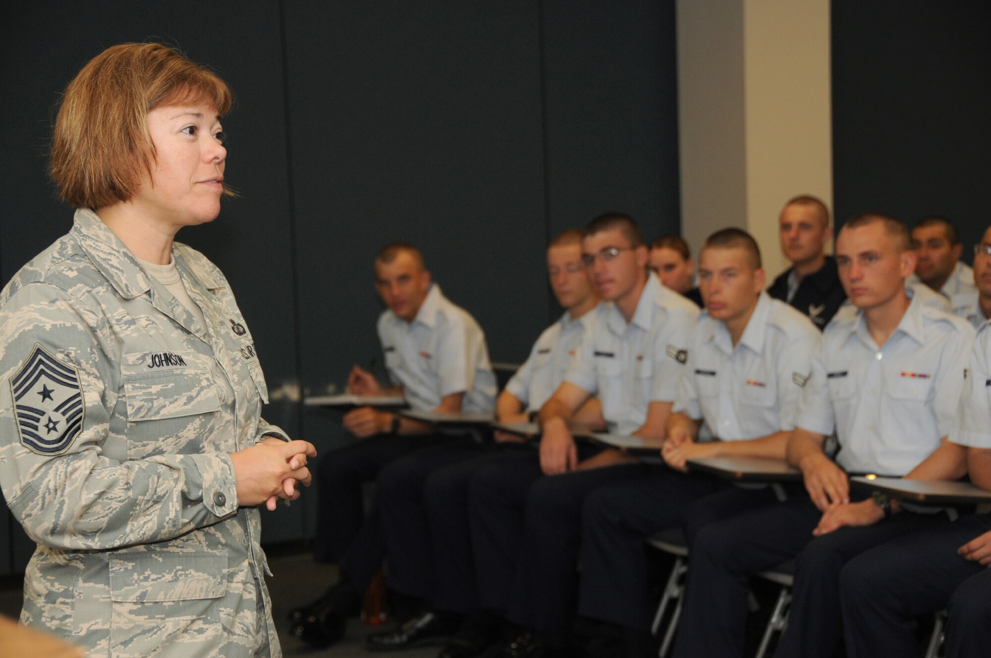 Chief Master Sgt. Angelica Johnson, the new 81st Training Wing command chief, delivers an inprocessing briefing to new students at the Levitow Training Support Facility Sept. 8.  (U.S. Air Force photo by Kemberly Groue)