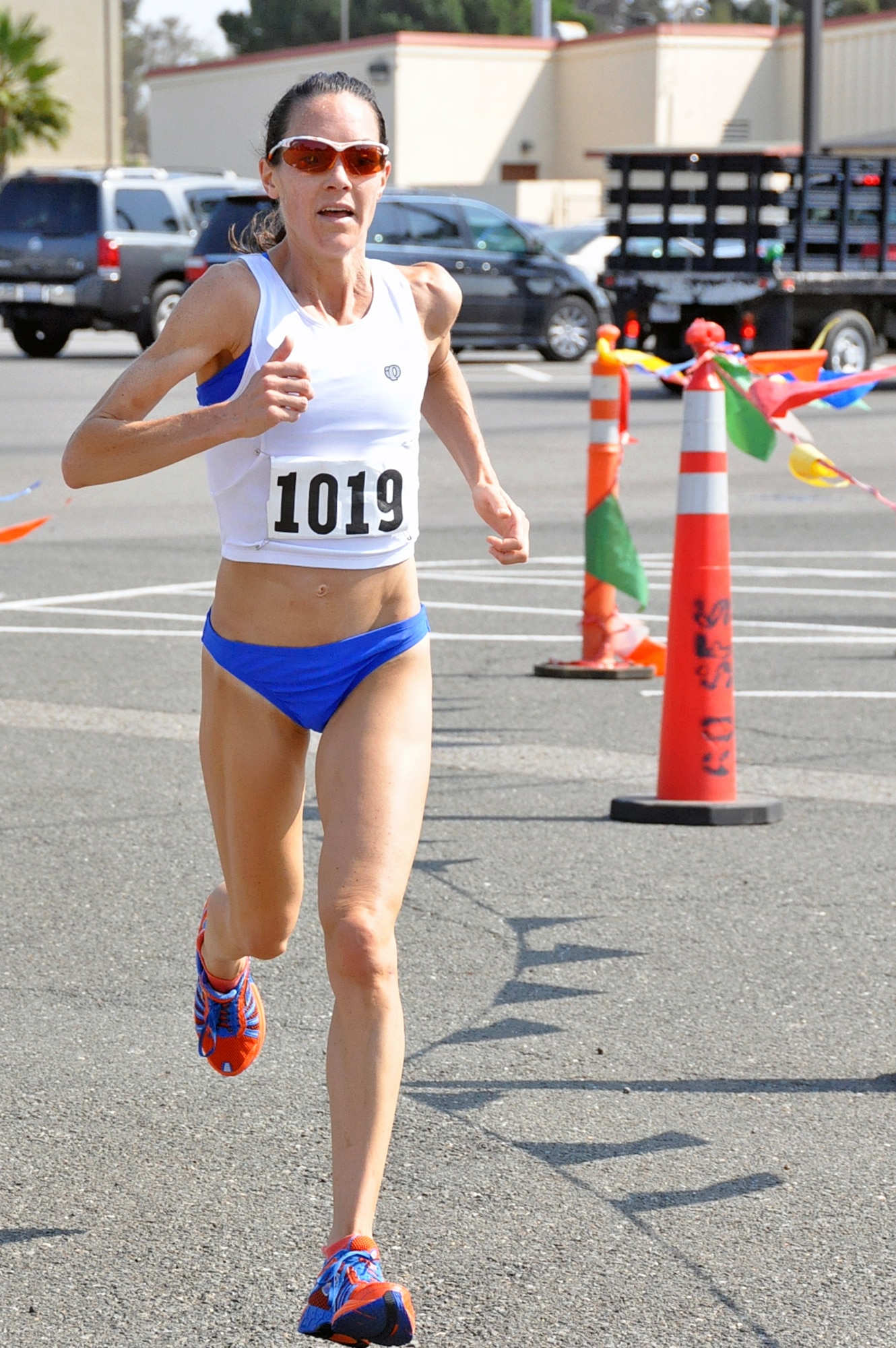 Allison Kerr, spouse of Capt. William Kerr 9th Air Refueling Squadron pilot, completes the final leg of the Triathlon, the three mile run, with a time of 1:12:20. (U.S. Air Force photo/ Airman Madelyn Ottem) 